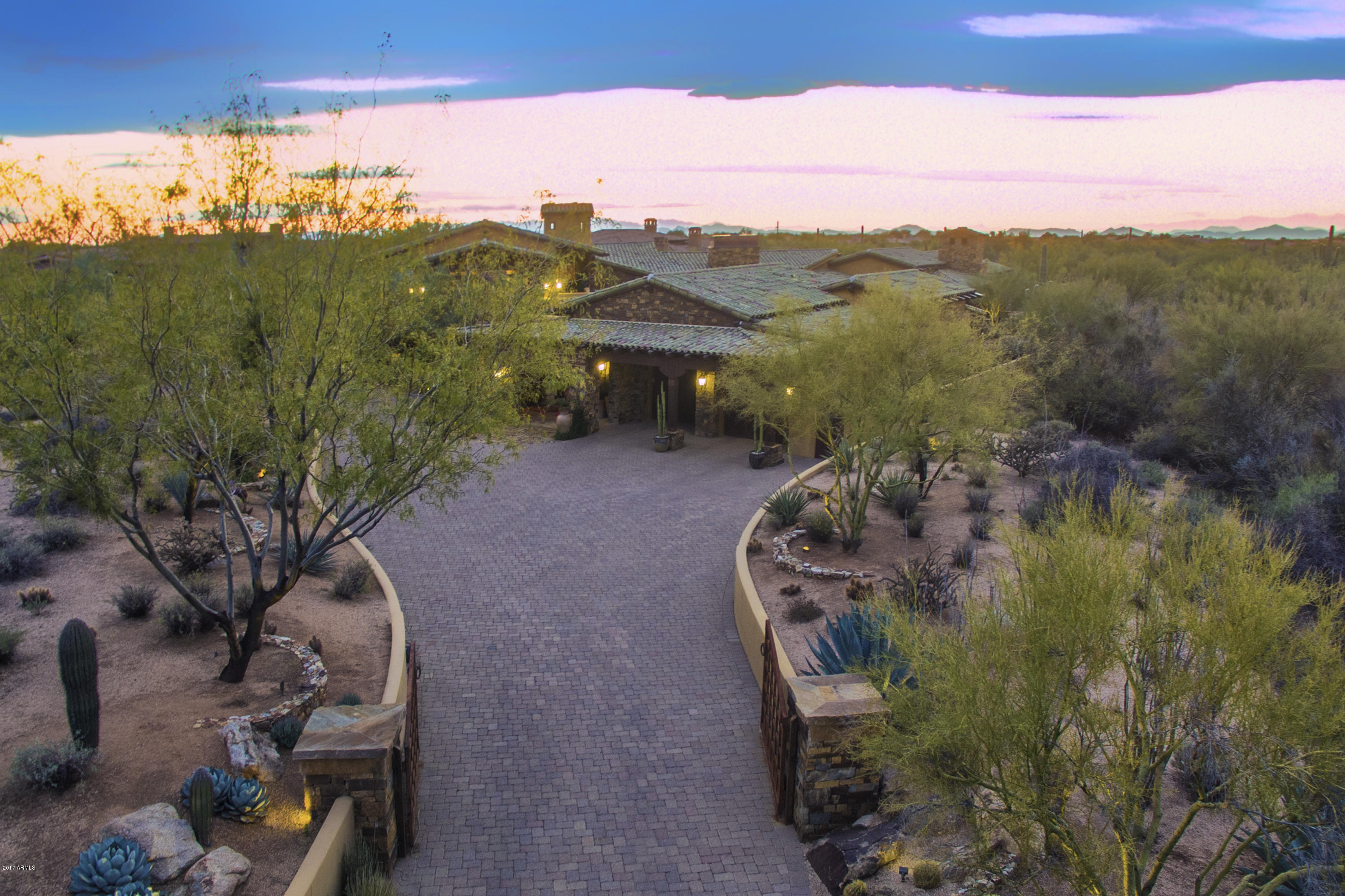 Elegant estate blending timeless architecture, privacy & views located on over 1.5 acres in the guard-gated community of Whisper Rock * Truly a serene setting with a sense of being in a botanical garden * Generous living spaces, private guest quarters, separate master retreat & detached casita provide ample room * Dedicated outdoor kitchen featuring a built-in wood burning pizza oven accompanies a bocce ball court, fire pits & stone fountain * Cozy fireplaces, natural stone & reclaimed wood floors, whole-home Control 4 automation, exotic granite slab counters, custom furniture grade cabinetry, designer appliances, rough sawn wood beams & Venetian plaster combine to create an incredible setting * Community amenities include concierge, fitness facility, heated pool & spa and 3-acre park