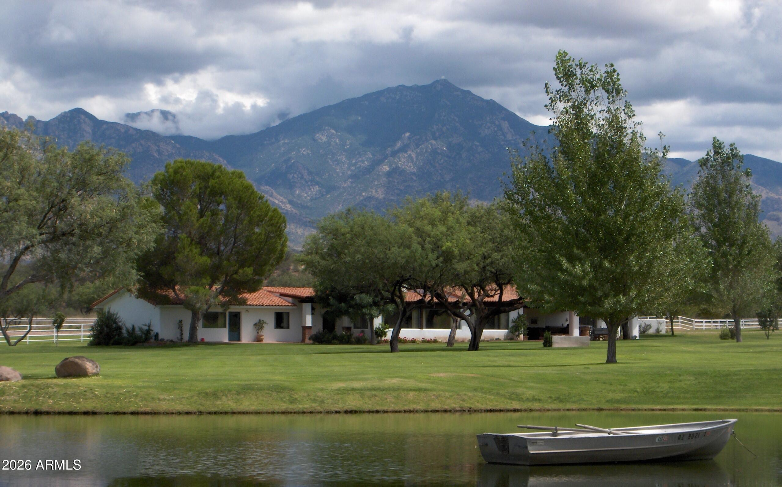 The 3,787 acre Montosa Canyon Ranch is the premier Gentleman's Ranch in Arizona. It is located 30 minutes south of Tucson in Santa Cruz County spreading out across 627 deeded acres of lush irrigated pastures and rich native grasslands. There are also 3,160 acres of State leased land adjacent to the deeded acreage creating the classic Arizona ranch that is second to none. The ranch is set amid the sweeping landscapes of southern Arizona between Green Valley and Tubac at an ideal 3,100-foot elevation where the days are warm and sunny and the nights cool and clear. With the towering Santa Rita and Tumacacori Mountains as its backdrop, the ranch has been developed to the very highest standards of quality artisan craftsmanship as an exceptional Spanish Colonial equestrian legacy estate. Excellent grandfathered irrigation water rights with a massive Flex Account with the AZ Department of Water Resources. 2 phenomenal irrigation wells both producing 1,000 GPM or more and 3 exempt wells on the deeded and 2 more wells on the State Leased land. Full video available.