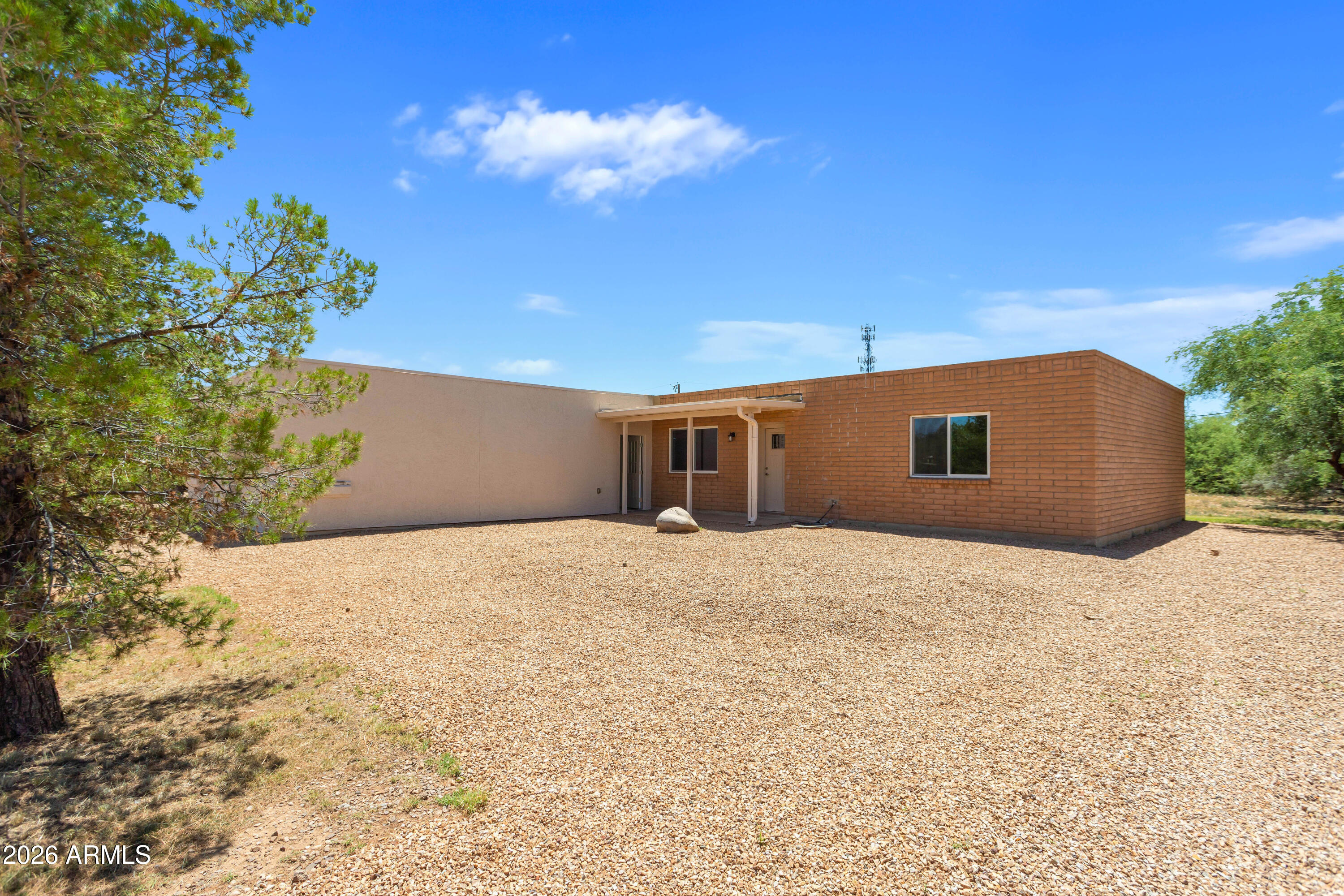 This newly remodeled 3-bedroom, 2-bath home with dedicated office space offers the perfect blend of quiet rural living and modern comfort. Interior upgrades include luxury vinyl plank flooring, custom hickory cabinetry, and A/C throughout. Situated on a spacious lot, the property also features an extended-length garage with plenty of room for vehicles, storage, or a workshop. This home is located just 20 minutes away from Sierra Vista or Benson. Owner/Agent. Buyer to verify sq ft.