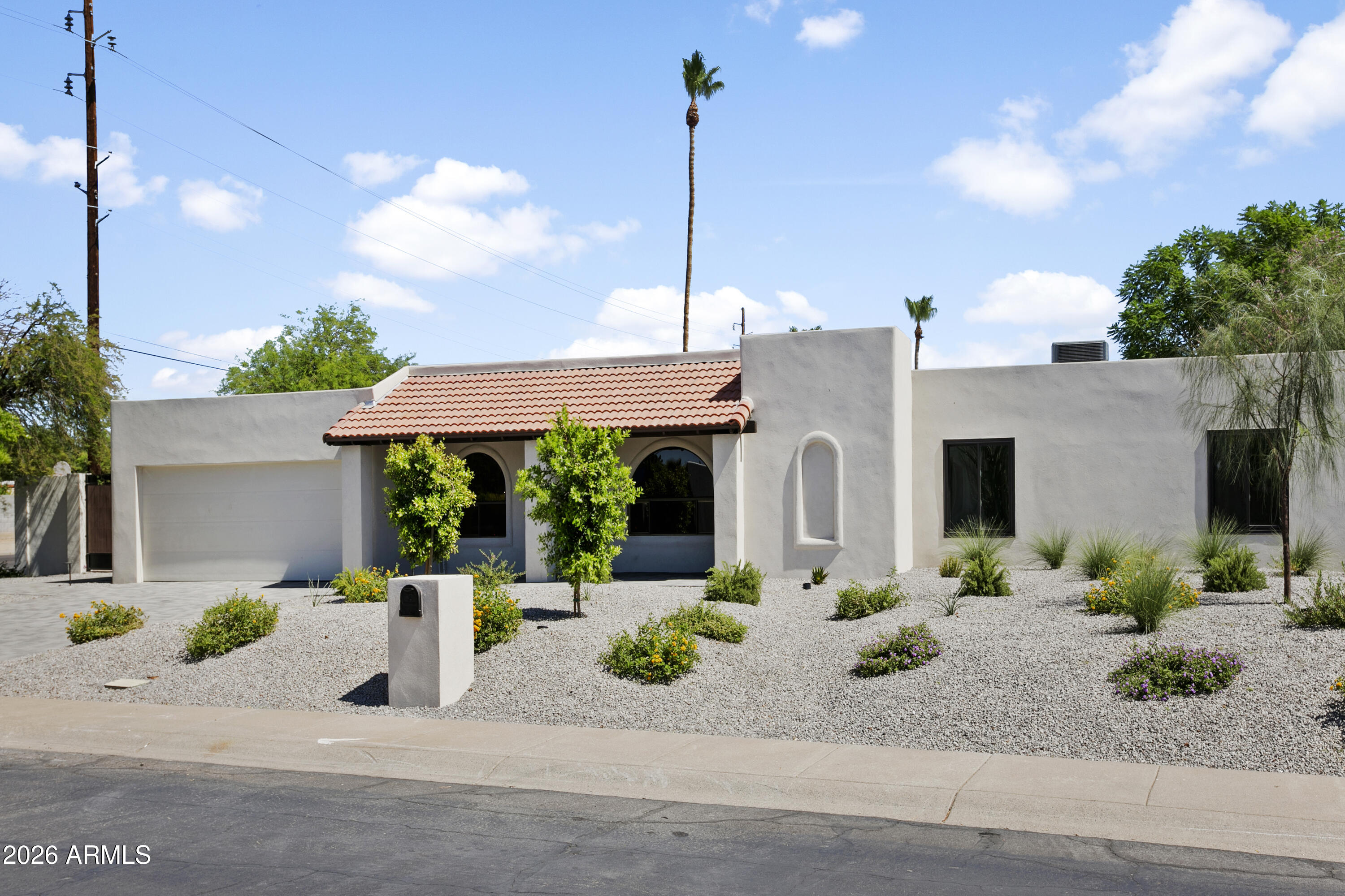Refined Living, Luxury Finishes, and a Location That Has It All. Welcome to 5602 E. Voltaire. This completely reimagined 4-bedroom, 3-bath single level Scottsdale home sits on an expansive near 1/3 acre corner lot, and delivers the kind of layout that flows elegantly. Thoughtfully designed at every turn, it's as functional as it is beautiful. This renovation goes further than high end designer cosmetic finishes, with major systems addressed, including a new roof, new paver driveway, and new professionally designed landscaping that creates breathtaking curb appeal, while offering the peace of mind of a new home while retaining the charm that comes with an established neighborhood. Natural light pours through the home, connecting seamlessly to a private backyard retreat where a sparkling pool and lush landscaping set the tone for relaxation and entertaining alike. Just a couple of blocks away is Sereno Park, offering a playground, expansive grassy areas, walking and biking paths, baseball and soccer fields, picnic areas, a horse arena, and restrooms. All this in a great location within five minutes of premier shopping, dining, and entertainment at Kierland Commons, Scottsdale Quarter, and the newly redeveloped Paradise Valley Mall. You'll also enjoy convenient access to the Mayo Clinic and major commuting routes including the Arizona State Route 101 Loop and Arizona State Route 51. This exceptional home combines style, space, location, and lifestyle, a rare opportunity in one of the Valley's most desirable areas. All with no HOA.