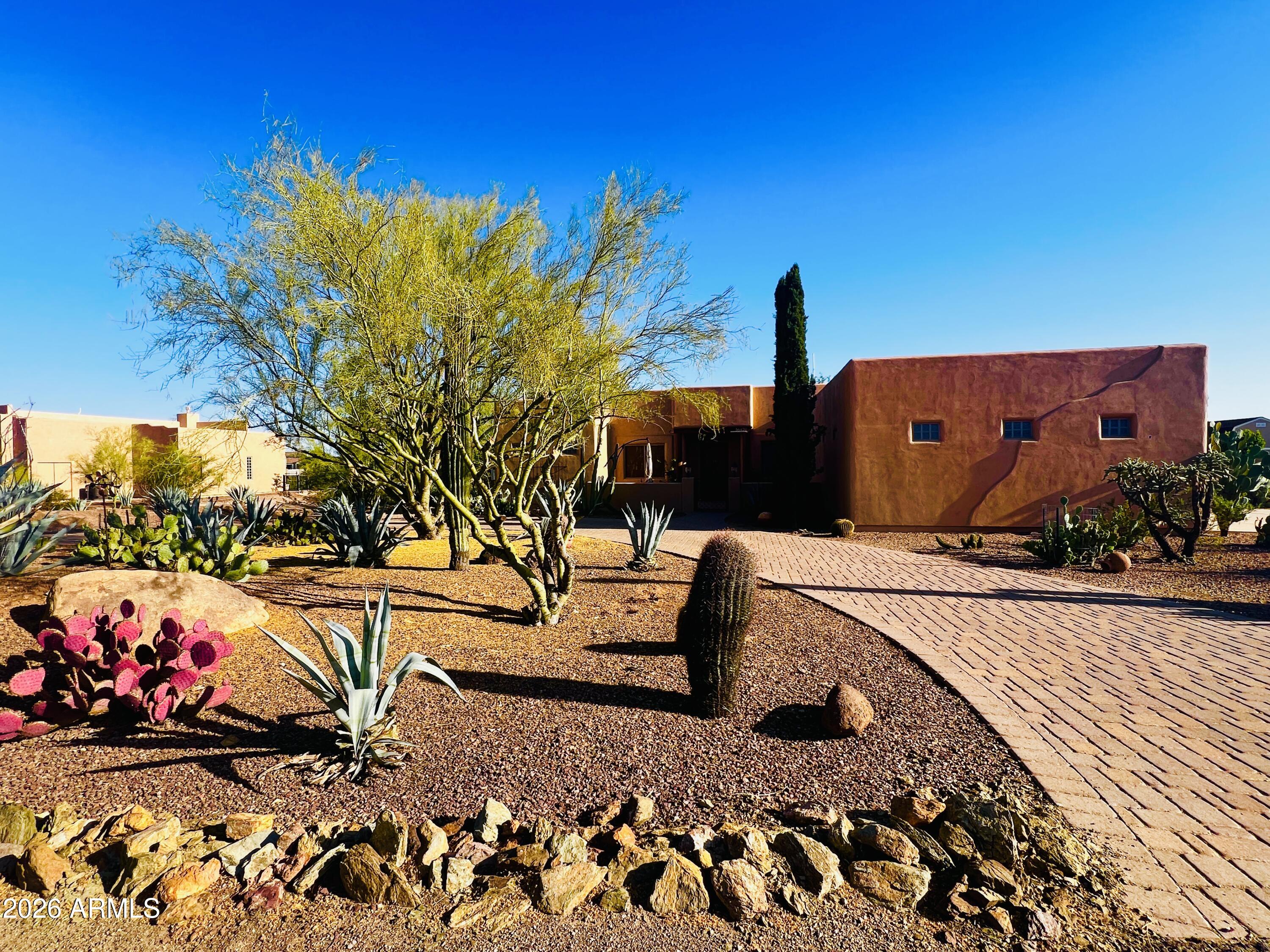 Nestled on a serene 1+ acre cul-de-sac lot, this stunning North Phoenix retreat offers the perfect blend of comfort and space in a private desert oasis. Featuring 4 bedrooms, 3 bathrooms, and a bright open-concept layout filled with natural light, this stunning home is designed for both everyday living and effortless entertaining. The culdesac lot features an oversized 3-car garage with epoxy flooring and built-in cabinets, ample RV parking, owned solar for energy efficiency, and a soft water system. Soak in stunning desert mountain views from the sparkling negative edge pool and screened Arizona room, and enjoy delicious harvests from your own gated garden. This peaceful property provides a true sense of privacy while still offering convenient access to shopping, dining, and I-17.