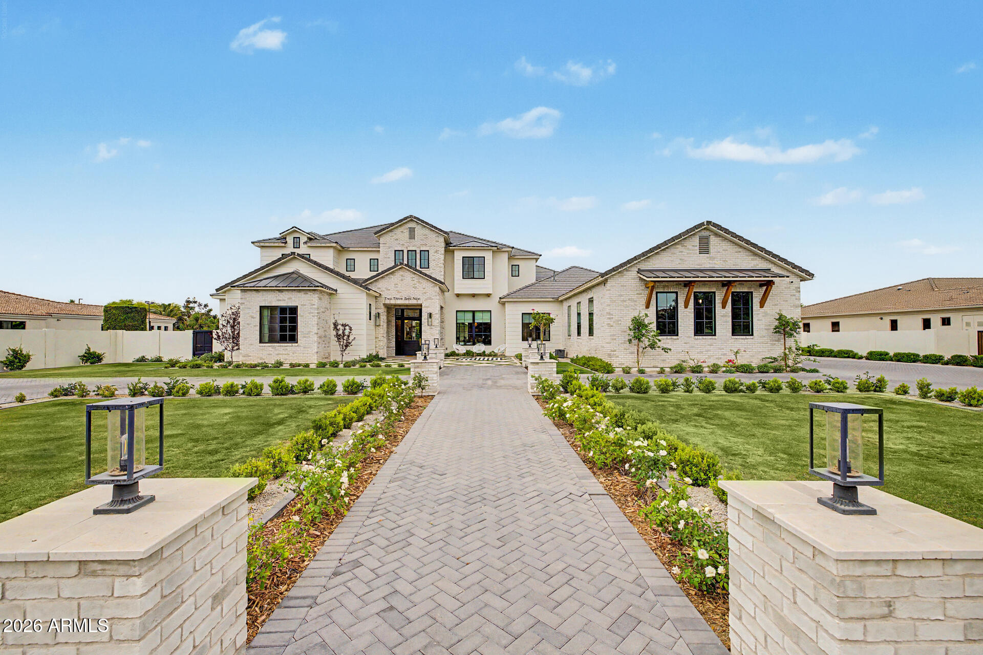 Welcome to the highly coveted community of Circle G at Silvercreek, where timeless architecture meets modern luxury. Completed in 2023, this exceptional custom estate was thoughtfully designed with uncompromising quality, functionality, and refined coastal-inspired elegance throughout.

From the moment you arrive, the classic facade and impeccable curb appeal set the tone for what awaits inside. Spanning expansive living spaces with soaring ceilings and an open-concept layout, the home offers five spacious en-suite bedrooms, a private den, and seamless indoor-outdoor living ideal for both everyday comfort and grand-scale entertaining.

The main-level primary retreat is a sanctuary of its own, featuring expansive dual walk-in closets complete with private laundry. Step directly from the suite into a secluded courtyard, already plumbed for an above-ground spa and outdoor shower, offering the perfect setting for a peaceful morning coffee or evening unwind.

Designed for the culinary enthusiast, the gourmet kitchen showcases premium Thermador appliances, including a 60-inch range, built-in 36-inch refrigerator and freezer columns, dual dishwashers, and a Scotsman ice maker. A fully equipped prep kitchen and walk-in pantry provide additional functionality, while stunning Mont Blanc honed quartzite countertops and custom millwork elevate the aesthetic to a level of refined sophistication.

The craftsmanship continues throughout the home with bespoke cabinetry, architectural detailing, and designer lighting that makes a lasting impression.

Entertainment options abound with a dedicated theater room and an expansive game room complete with a full bath and direct backyard access--offering flexibility as a guest suite, additional bedroom, or multi-generational living space.

Upstairs, a secondary den opens to an impressive 500-square-foot covered patio capturing breathtaking San Tan Mountain views. This versatile space can remain an outdoor retreat or be enclosed to further expand the home's already generous footprint.

Every bedroom is thoughtfully designed with its own walk-in closet and private bath. An additional upstairs laundry area brings the total to three separate laundry facilities, delivering unmatched convenience for large households or guests.

Even four-legged family members were considered, with a dedicated pet space featuring a built-in wash station and private dog run.

The oversized bunk room is a standout feature, designed to comfortably accommodate four queen beds--ideal for children, grandchildren, or hosting memorable sleepovers.

Car enthusiasts and adventure seekers will appreciate the extended four-car garage in addition to a full-size RV garage, offering nearly 2,400 square feet of garage space--perfect for vehicles, boats, and recreational toys.

The resort-caliber backyard rivals luxury retreats, complete with a pickleball court, basketball area, putting green, oversized diving pool with expansive Baja shelf, 14-person spa, outdoor chef's kitchen, separate ramada, and a pass-through window for effortless indoor-outdoor entertaining.

This extraordinary custom estate was meticulously designed with every imaginable amenity. A rare opportunity to own one of the most thoughtfully crafted homes in Circle G at Silvercreek.