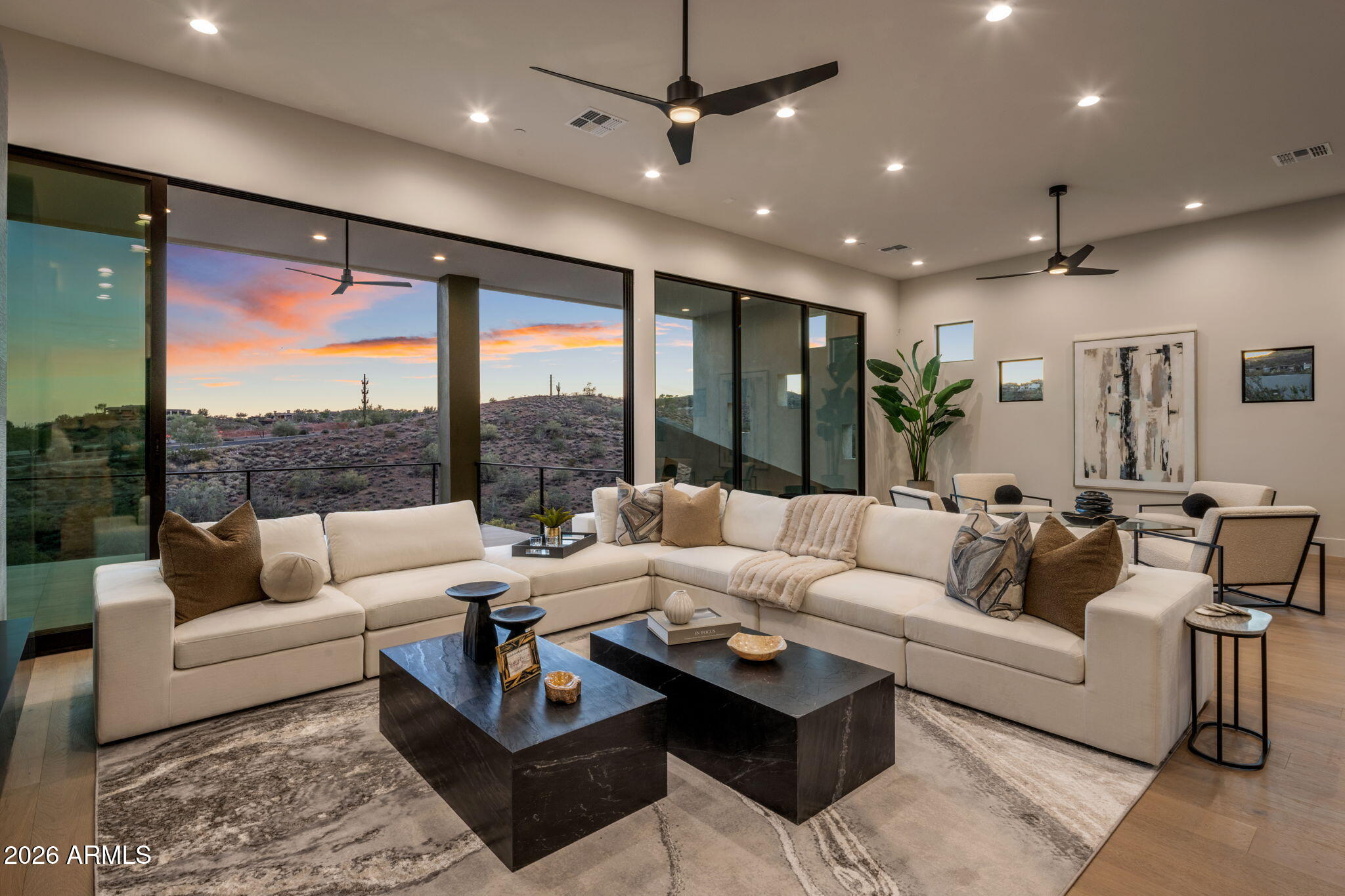 Introducing a 2026 masterpiece by Picasso Homes, nestled within the exclusive gated enclave of Palatial Estates in Fountain Hills. This striking modern-contemporary residence seamlessly blends architectural sophistication with elevated everyday living.  Spanning two thoughtfully designed levels. The primary suite is privately situated on the main level, creating a true retreat complete with a serene sitting area and spa-inspired bath.  Designed for both grand entertaining and comfortable living, the main floor features a formal dining room, a dedicated office, and an expansive open-concept kitchen outfitted with premium finishes and seamless flow into the living spaces, powder room, spacious laundry and key drop.  Downstairs: 3 spacious bedrooms, each w/its own ensuite bath along with an an additional powder,  a theatre room and versatile flex space with a built-in bar, refrigerator, and sink provide the perfect setting for hosting or relaxing. Be captivated by the sunsets from the walk out patio.  Step outside to your own resort-style backyard, where a sparkling pool and spa, built-in BBQ, and multiple lounging areas invite year-round enjoyment under Arizona skies--all framed by stunning views. A 4-car garage completes the home, offering ample space for collectors and convenience alike.  Rare opportunity to own a brand-new, design-forward luxury residence in one of the area's most known gated communities.