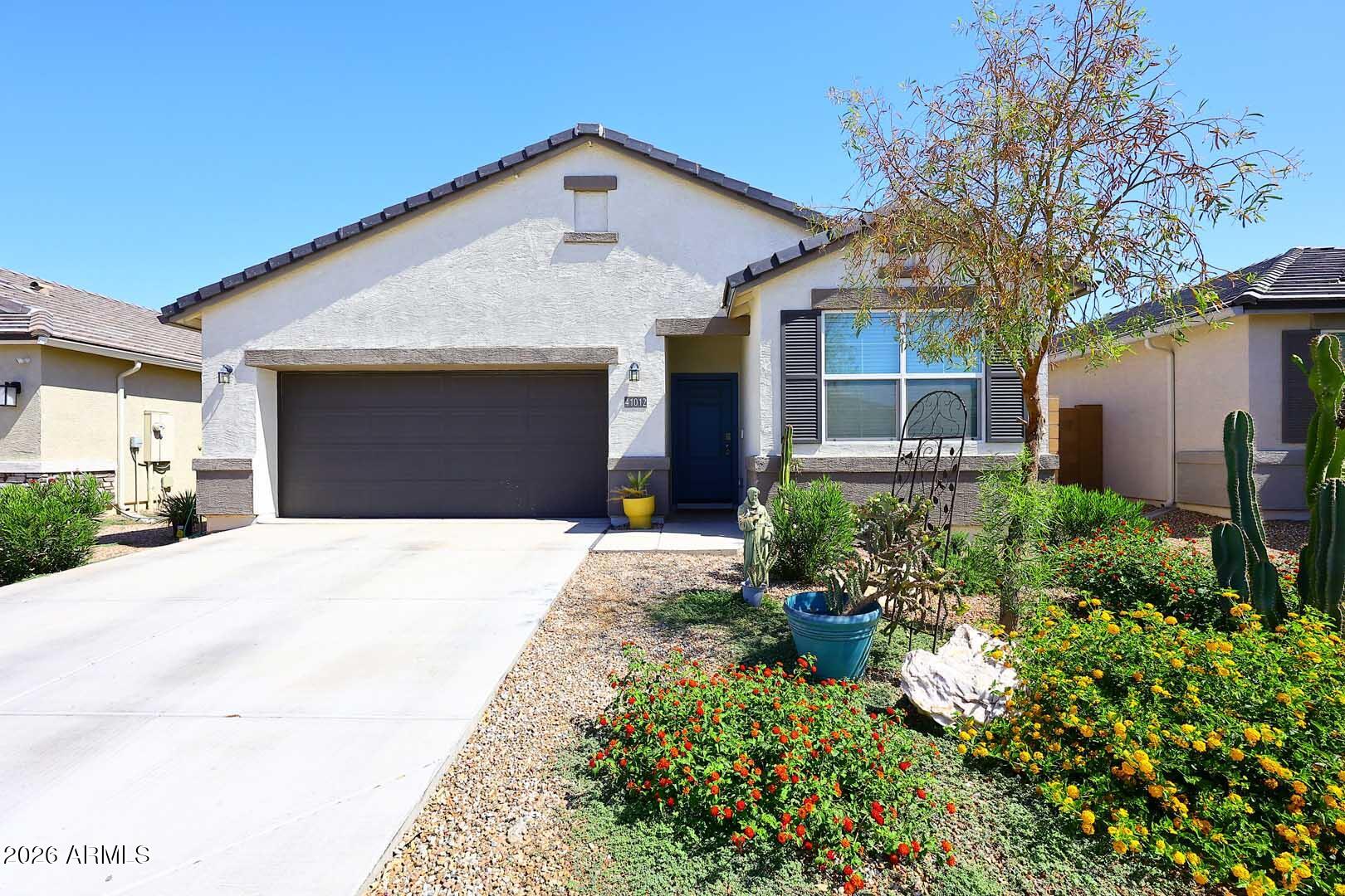 Beautiful single story 3 bedroom, 2 bathroom home with a highly desirable tandem 3 car garage located in the sought-after Rancho El Dorado community of Maricopa. This move in ready home features a bright open concept floor plan designed for modern living. The spacious great room flows seamlessly into the kitchen and dining area, creating the perfect space for entertaining, family gatherings, and everyday comfort. Large windows provide abundant natural light throughout the home, enhancing the open and inviting atmosphere.
The private primary suite offers a spacious bedroom, well appointed bathroom, and generous closet space. Two additional bedrooms provide flexibility for guests, a home office, a hobby room, or growing family needs. One of the standout features of this property is the highly sought after tandem 3 car garage, offering ample room for multiple vehicles, storage, tools, recreational equipment, or a workshop area.
Located in Rancho El Dorado, one of Maricopa's most popular master planned communities, residents enjoy nearby parks, walking paths, golf, schools, shopping, dining, and convenient access to State Route 347 for commuting to the Phoenix metropolitan area.

Whether you are a first time homebuyer, looking to downsize, searching for a lock and leave Arizona home, or seeking a great investment property, this home offers exceptional value, location, and functionality. Don't miss your opportunity to own this beautiful move in ready home in Maricopa, Arizona.