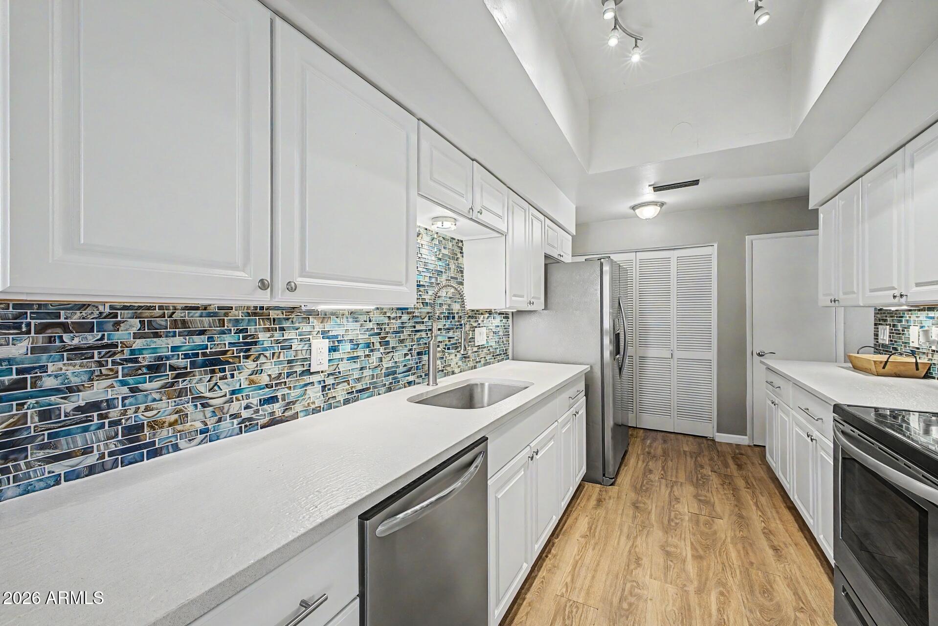 RARE opportunity to live in The Lakes for under $300K! Move-in ready condo at Runaway Point! This two-level condo includes 2 beds, 2 baths and 1,144 sqft. The downstairs' large windows and sliding door to the patio allow plenty of natural light into the living room, dining room and kitchen. The downstairs also has newer floors and the kitchen cabinets were also recently replaced. The upstairs includes both bedrooms, each with access to the balcony, and both bathrooms. Runaway Point residents have access to The Lakes Clubhouse where they can enjoy the heated junior-olympic lap pool, tennis/pickleball courts, fitness and cardio rooms and much more! You'll Love Living in The Lakes!  PHOTOS COMING SOON!