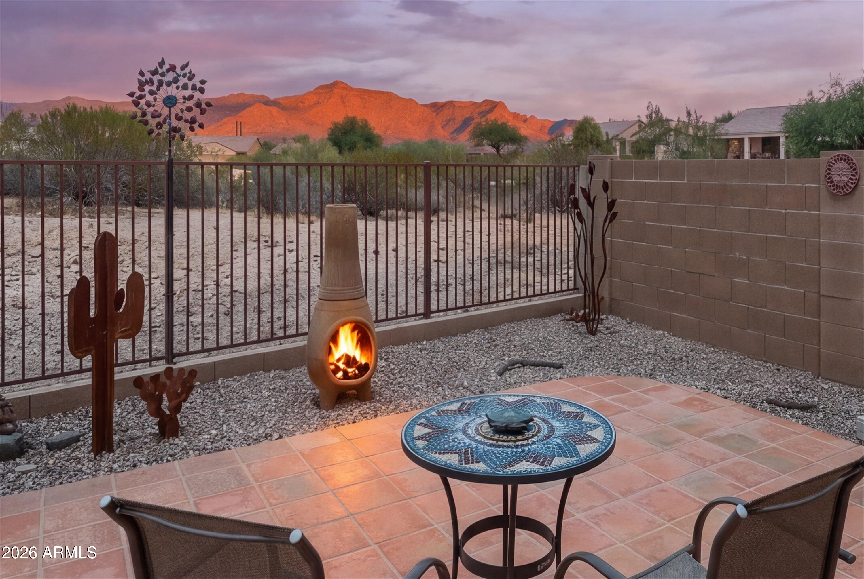 WOW!  ***Location, Location, Location!*** You'll Love this Fantastic Home on Desirable North-South PREMIUM SUPERSTITION MOUNTAIN VIEW LOT with so much to offer including...2 Split Bdrms + Separate Den, Private yard, like new HOT TUB, Full Extended Covered Patio + View Fence with No Homes directly behind! ***You'll Enjoy MANY UPDATES & Upgrades: Tasteful Tile Floors through-out (ZERO CARPET), Gorgeous Granite, Like New Appliances, Raised Panel Cabinetry, New Lighting, NEW ROOF (2026), New Exterior Paint (2026), Newer Interior Paint and More! ***This WELL-MAINTAINED home is IMMACULATE, shows great and is ready for new owners to just move in and ENJOY! ***This POPULAR GATED NEIGHBORHOOD offers RARE AMENITIES including Beautiful Community Pool+ Rec/Fitness Center too!  HOA FEE also includes .. ... Garbage Service & Walking Trails!  ***Conveniently Located close to WORLD CLASS HIKING and Gold Canyon Golf Resort, which offers two 18-hole Championship golf courses (Dinosaur Mountain and Sidewinder) and Expansive PATIO DINING with amazing golf and mountain views! ***Nature lovers will ENJOY the nearby 2.9 million acres of Tonto National Forest wilderness, hiking, off-road trails plus four beautiful, pristine lakes too! Conveniently located just 35 minutes from Sky Harbor Airport and 20 minutes from Mesa Gateway Airport and San Tan Village Shopping & Dining! ***You'll LOVE the GOLD CANYON LIFESTYLE!