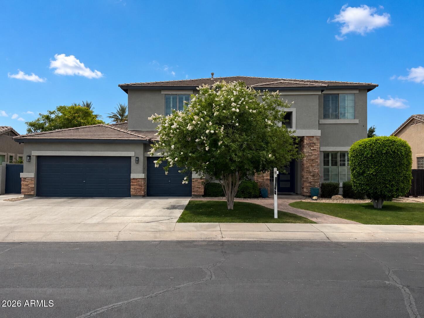 This is the kind of home that makes people stop scrolling. Nestled in sought-after Palm Valley in Goodyear, this contemporary home blends luxury, comfort, Zen and the Arizona lifestyle buyers crave. Rich wood flooring, plantation shutters, and beautifully remodeled kitchen create a warm yet elevated feel throughout. The open layout is perfect for both everyday living and entertaining. The downstairs primary suite offers a private retreat, while upstairs features a spacious loft large bedrooms and dramatic catwalk overlooking the main living space. Outside, enjoy a resort-style backyard with a diving pool, water feature, built-in BBQ, oversized patio. Plenty of room for outdoor toys with RV gate, and 3 car garage. Amenities include golf course, pools, sports courts, parks, tot lots and more