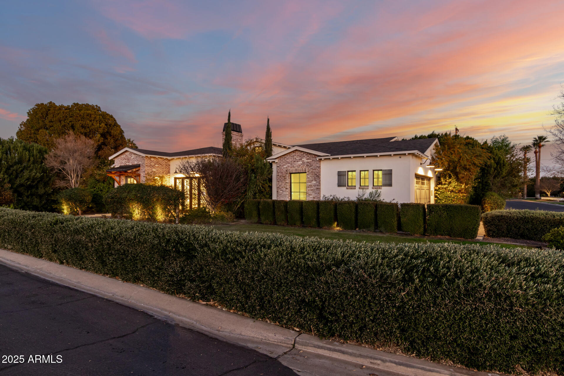 Stunning custom built Arcadia ranch home is now available. Nestled on a corner lot on a serene street w/ breathtaking views of Camelback Mountain, no detail has been spared with the design & functionality of the home. Available FULLY furnished with curated designer fixtures and furnishings.  Split plan with primary suite and double doors for private backyard access. Expansive kitchen with 10' island, large walk in pantry, Thermador appliances, ice maker, and custom cabinetry. Great room concept keeps family & friends connected. Speakers throughout the home. Retractable wall extends to private outdoor living. Custom heated pool, artificial turf, & a large outdoor kitchen featuring built in BBQ, kegerator, fridge, outdoor fireplace & bar top all set amongst a Camelback Mountain backdrop.