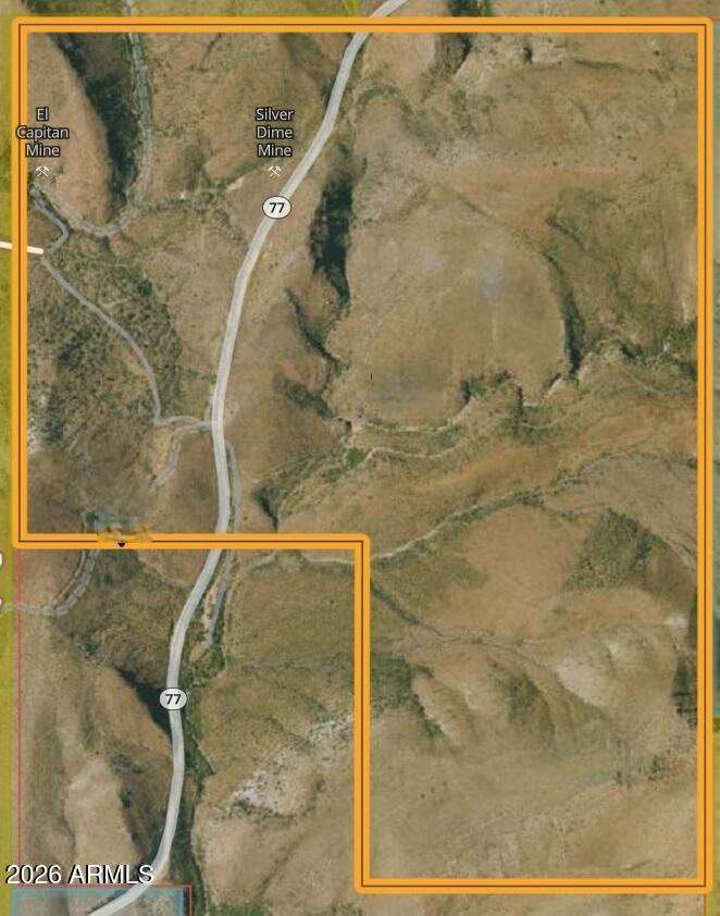 642± acres of pristine Arizona land with Silver Creek along the west boundary—where two former gold mines sit near the creek—and two canyons converging to form El Capitan Canyon on the east. A 4x4 trail leads to the mountain top, offering breathtaking 360° views and an exceptional home site location. Borders State Trust land on the east and currently used for AG cattle grazing. With 3,960 feet of frontage on AZ Scenic Highway 77 and one existing well, this rare property offers water, access, and outstanding ranch, recreation, or investment potential. 642± Acres | Silver Creek Ranch Land | Scenic Highway 77
________________________________________
EXECUTIVE SUMMARY
Offered for sale is an exceptional 642± acre ranch and recreational holding located along Arizona Scenic Highway 77. This rare property features live water, dramatic canyon topography, mountain-top building potential, and extensive highway frontage. With Silver Creek forming the western boundary and two canyons converging into El Capitan Canyon on the east, the property delivers a combination of beauty, access, and long-term investment potential seldom available in one offering.
Currently utilized for agricultural cattle grazing, the land offers flexibility for ranching, recreation, residential development, or legacy ownership.
________________________________________
PROPERTY HIGHLIGHTS
"	642± deeded acres
"	Silver Creek frontage on the west boundary
"	Two historic former gold mines located near the creek
"	Two canyons merging to form El Capitan Canyon on the east
"	4x4 trail access to mountain top
"	360-degree panoramic views
"	Ideal elevated home site
"	Borders Arizona State Trust Land on the east boundary
"	3,960 feet of frontage on AZ Scenic Highway 77
"	One existing well
"	Current AG use - cattle grazing
________________________________________
LAND & TOPOGRAPHY
This diverse landscape offers rolling terrain, canyon features, creek frontage, and elevated ridgelines. A 4x4 trail provides access to the mountain summit, where expansive 360-degree views create an extraordinary potential homesite or lodge location.
The western boundary follows Silver Creek, enhancing wildlife habitat and recreational appeal. Two historic former gold mines add character and potential historical interest to the property.
On the eastern side, two dramatic canyons converge to form El Capitan Canyon, adding geological distinction and natural privacy.
________________________________________
LOCATION & ACCESS
"	Situated along AZ Scenic Highway 77
"	3,960 feet of direct highway frontage
"	Easy year-round access
"	Borders State Trust Land, expanding privacy and open-space feel
The highway frontage enhances accessibility for ranching operations, recreational use, or future development considerations.
________________________________________
WATER & INFRASTRUCTURE
"	One existing well
"	Natural surface water via Silver Creek
"	Established agricultural use
Water presence significantly strengthens long-term usability and value.
________________________________________
INVESTMENT POTENTIAL
This offering presents a rare opportunity to acquire a large, contiguous acreage parcel with:
"	Live water
"	Scenic topography
"	Historic mining character
"	Highway frontage
"	Elevated building sites
"	Adjacent protected land
Suitable for:
"	Private ranch ownership
"	Recreational retreat
"	Estate development
"	Agricultural continuation
"	Long-term land banking investment
________________________________________
CONCLUSION
Large tracts with water, highway access, canyon features, and panoramic homesites are increasingly difficult to find. This 642± acre property combines natural beauty, historic character, and functional ranch infrastructure in a strategic and highly desirable location.