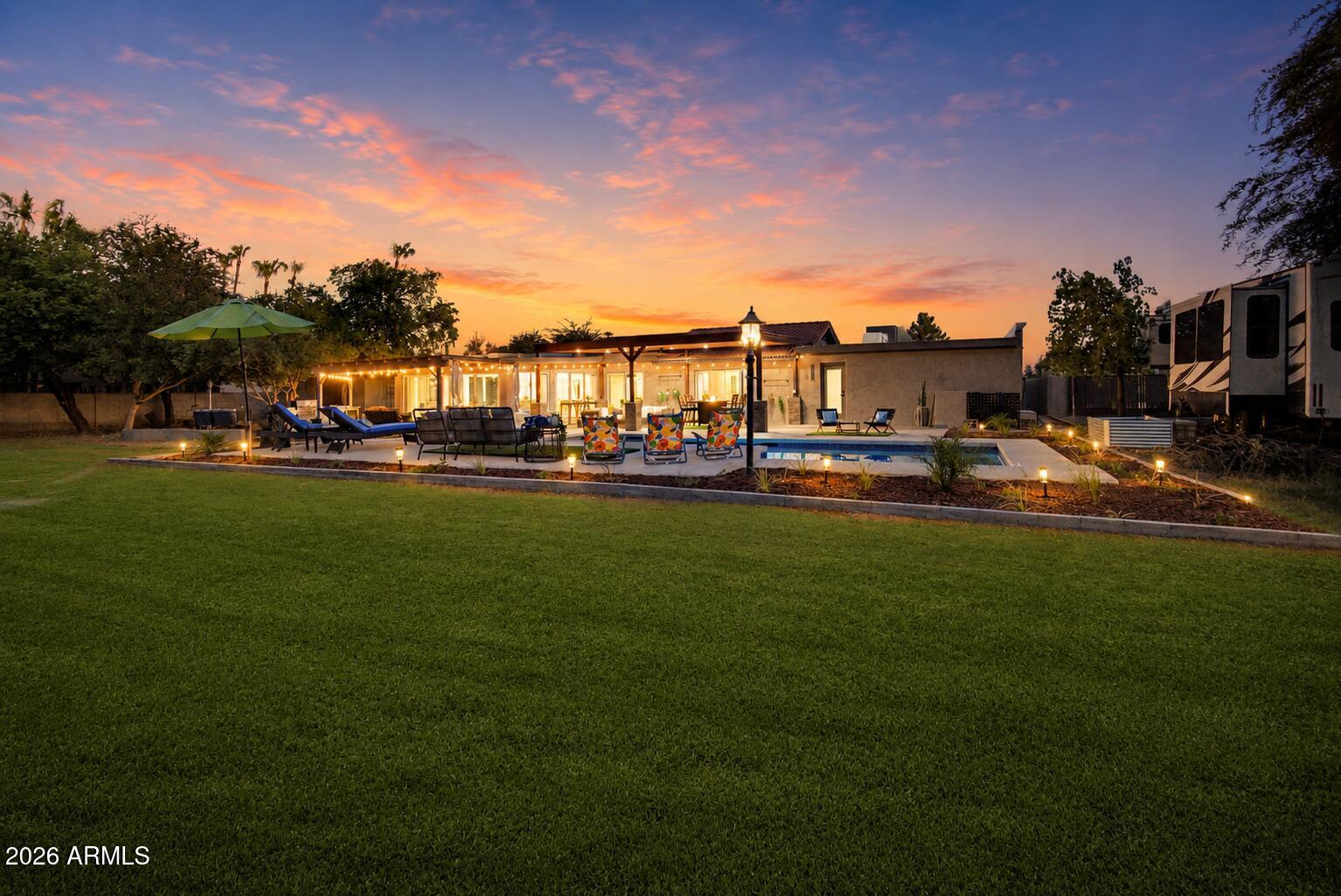 Rarely does a property offer this much flexibility, privacy, and quality at this price point. It's proof that you don't need a magic ZIP code to enjoy an extraordinary lifestyle. 

Discover why Longhorn Ranch II has quietly become one of the Valley's best-kept secrets.
Set on a .81-acre, flood-irrigated lot in Longhorn Ranch II, this fully remodeled estate combines the freedom of NO HOA living with luxury, craftsmanship, and quality today's buyers crave. 

The open-concept split floor plan features multiple living spaces plus a bonus sunroom, ideal for hobbies, home office, gym or multigenerational living.

Outside, your private resort awaits: stunning timber pavilion, NEW pool, outdoor kitchen and entertaining spaces, firepit, mature trees, lush lawn, detached 20x24 shop, and more.