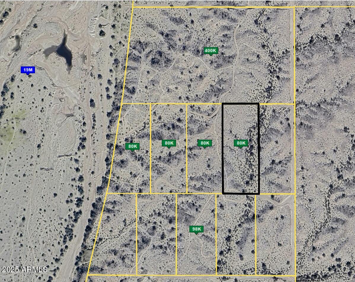 Here's your 4-acre launchpad in one of Arizona's fastest-growing tech corridors—just a mile from Tartesso and 15 minutes from the planned $20B Tract Data Center. Terravelis, the future mega-city, is rising just 15-20 minutes north, and you're in prime position. This lot is surveyed, out of the flood zone, and ready to build (1-acre minimum). Positioned just under 300 feet from an electrical easement, with nearby wells averaging 200-220 feet in depth. APS electric runs nearby, surrounded by high-growth developments like solar farms, a proposed Hollywood studio, and Bill Gates' ''Smart City.'' Road access is in place. Buy now, or wish you had—this is what early looks like.