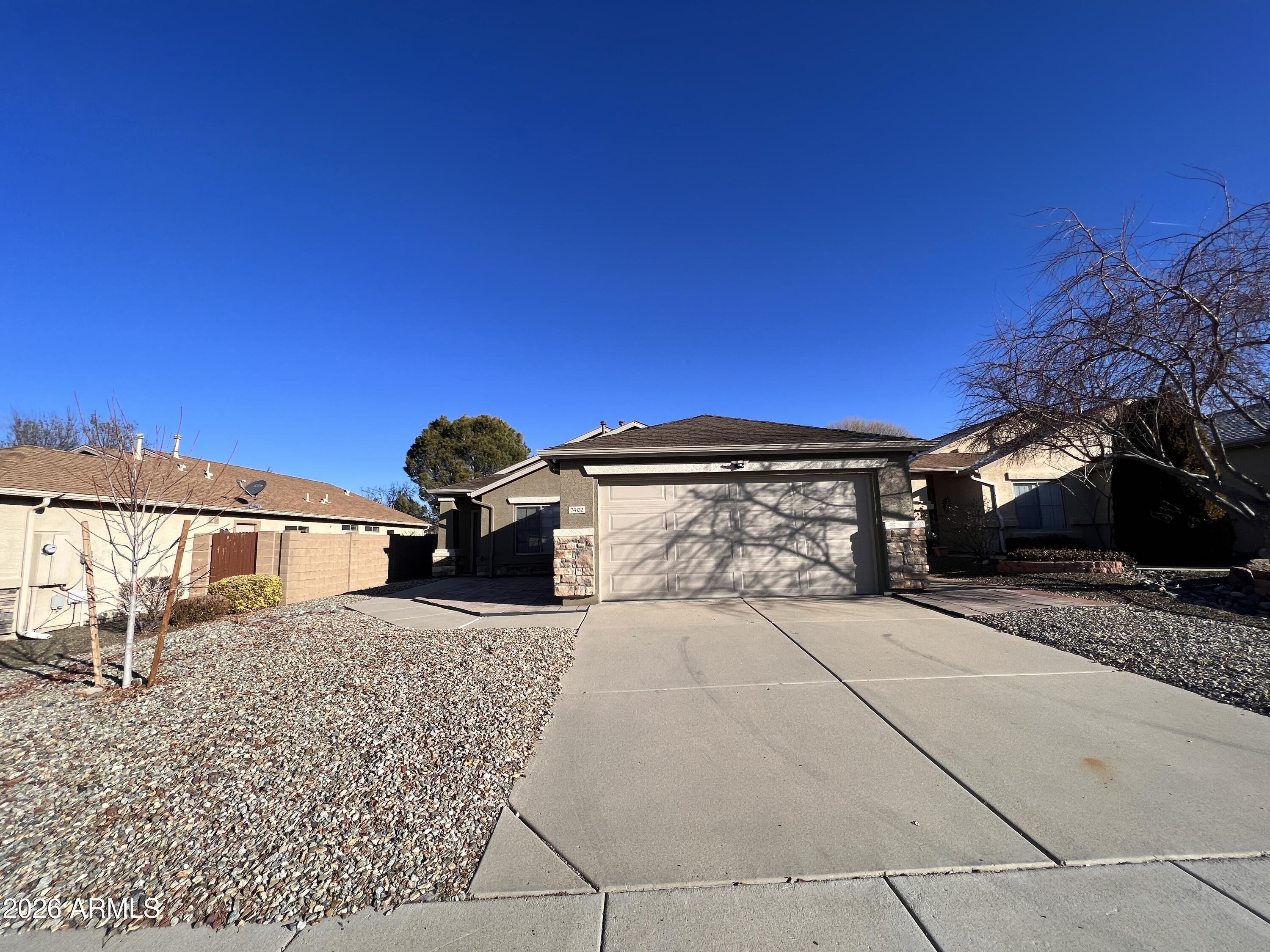 Located in the desirable Viewpoint community in Prescott Valley, this inviting 3-bedroom, 2-bath home offers comfortable living with a functional and well-designed layout. The open-concept floor plan seamlessly connects the kitchen, dining, and living areas, creating a bright and welcoming space that's perfect for both everyday living and entertaining. The kitchen features beautiful granite countertops and plenty of workspace, making meal prep and gatherings easy and enjoyable. A split floor plan provides added privacy, with the primary suite separated from the additional bedrooms for a more peaceful retreat. Step outside to a fully fenced, private backyard--ideal for relaxing, gardening, pets, or enjoying Prescott Valley's beautiful weather. The home also includes a convenient 2-car garage and is located just down the street from a neighborhood park, offering easy access to outdoor recreation and green space. With its desirable location, practical layout, and inviting features, this home is a wonderful opportunity to enjoy comfortable living in one of Prescott Valley's popular neighborhoods.