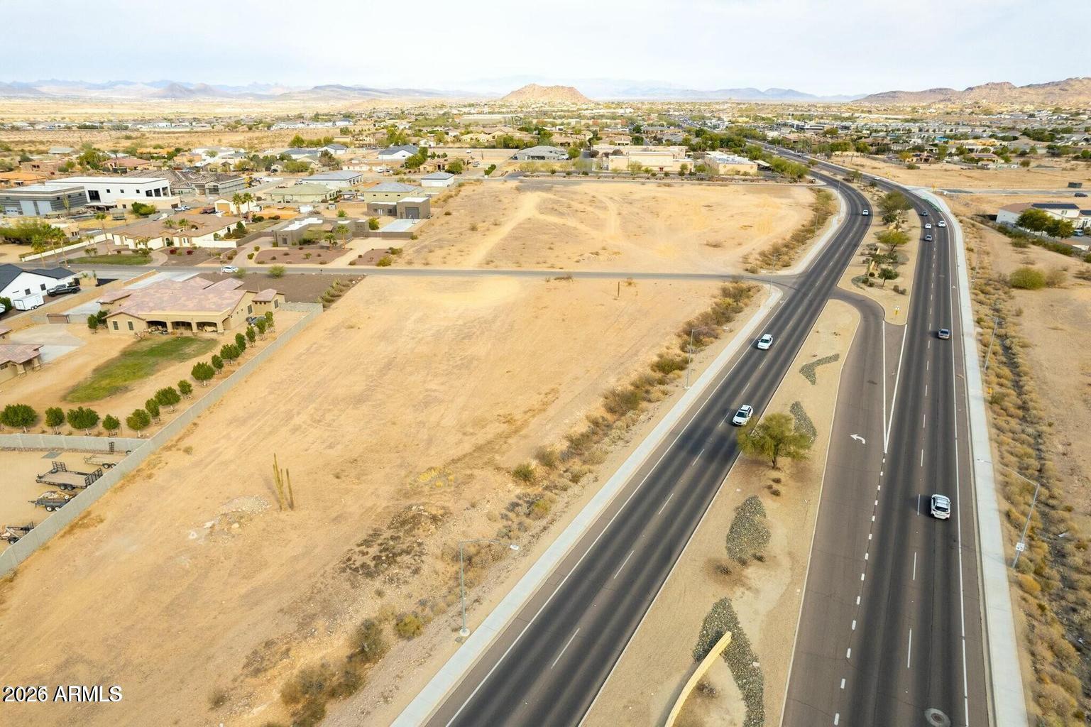 Great opportunity to build your dream home  in a neighborhood surrounded by million-dollar properties--and with no HOA! This .67-acre lot is ready for your vision. This lot is special because it has access to sewer and most of the neighbors are on septic. Access to water is on Avenida del sol and access to electricity is 3 lots west. Lot is close to freeways, shopping, dining, hiking trails, and under 20 miles away from Lake Pleasant.
