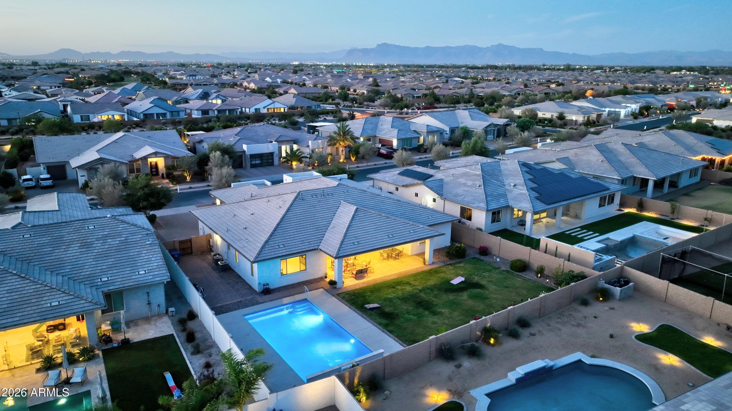 Welcome to the luxurious Heritage Collection at Meridian, a master-planned community known for its amazing outdoor amenities, location adjacent to the Queen Creek wash trail for hiking, biking, & equestrian use, several nearby golf courses, & close proximity to shopping, restaurants, & entertainment at popular destinations like the Olive Mill, Schnepf Farms, & everything downtown Queen Creek!

This 4 BD, 3.5 BA single-level home expands over 3600 SF & seamlessly features open-concept living, two additional bonus rooms, a split 3 car garage, an oversized lot complete with pool, carefully landscaped yard space, extended covered patio for relaxation or entertainment, and over $100K in upgraded features. Inside the home, there is wood-look plank tile flooring & two-tone interior paint throughout, neutral carpeting in secondary bedrooms, a tankless water heater, white quartz countertops & a chef's kitchen with soft water system and reverse osmosis, gourmet GE S/S appliances, gas range, double ovens, tile backsplash, upgraded cabinets, pendant & under-cabinet lighting, a butler's pantry, & a massive walk-through pantry. An expansive laundry room already pre-plumbed for a sink, offers separate home access to the single car garage & plenty of storage.  

Featuring separate space for an office & formal living or dining, a large family room open to the gorgeous kitchen & covered patio through multi-slider doors, split bedrooms which include a primary suite along one side with its own private patio access, en-suite bath including double vanities & make-up station, free-standing Kohler tub, large tiled walk-in shower, & oversized walk-in closet, this home shows thoughtfully curated attention for the most sophisticated buyer. Three additional bedrooms with large walk-in closets, including one with its own private en-suite bath, incorporate the other wing of the home to give plenty of peace & privacy for guests. 

The backyard oasis is move-in ready while still offering ample opportunity for custom additions to suit your personal wants and needs. Situated on an approx. 13,371 SF lot, the thoughtfully landscaped backyard features a newer-constructed pool complete with water features and relaxing therapy jets, creating the perfect balance of luxury and tranquility. Designed with both entertaining and everyday respite in mind, this outdoor retreat offers an exceptional setting to gather, unwind, and enjoy Arizona living at its finest. Located only 8.5 MI from Phoenix-Mesa Gateway Airport, 6 MI from SR24, 4.9 MI from Queen Creek Marketplace, & 36.7 MI from Sky Harbor Airport, this opportunity will NOT last long! See this gorgeous property for yourself & make an offer before it's GONE!!!!