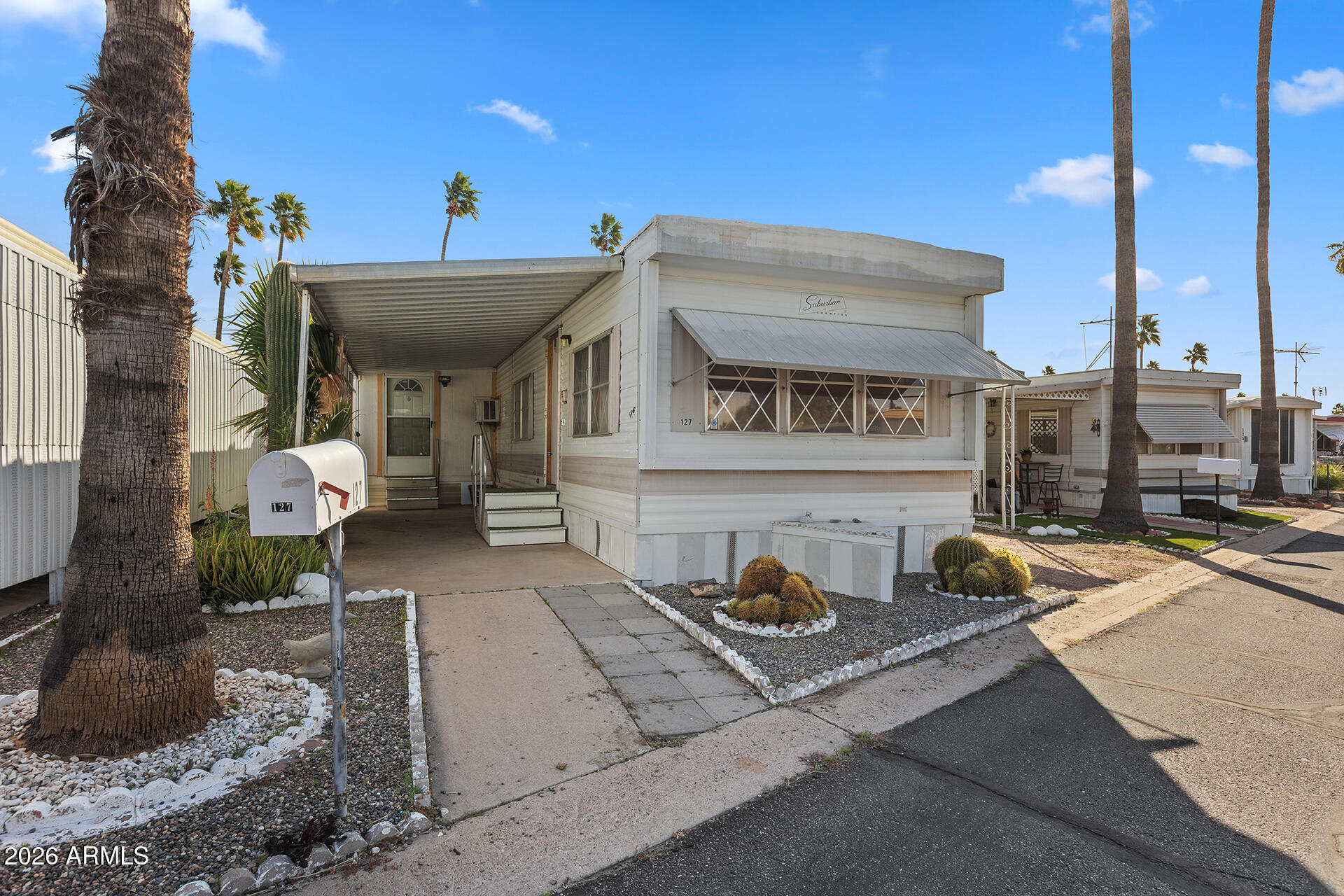 Beautifully remodeled manufactured home in the desirable 55+ Rosehaven Estates community! This 2-bedroom, 1-bath residence was updated in 2024 and offers fresh, modern feel throughout. Interior improvement include updated flooring, refreshed kitchen and bath finishes, and a bright, open living space designed for comfortable everyday living. The functional floor plan provides flexibility for full-time living or seasonal retreat. Located in Apache Junction with convenient access to shopping, dining, and other outdoor recreation, including the nearby Superstition Mountains. Rosehaven Estates is a well-maintained 55+ community offering a relaxed lifestyle and convenient access to major roadways. Move-in ready and ideal for buyers seeking comfort, affordability, and low-maintenance living.