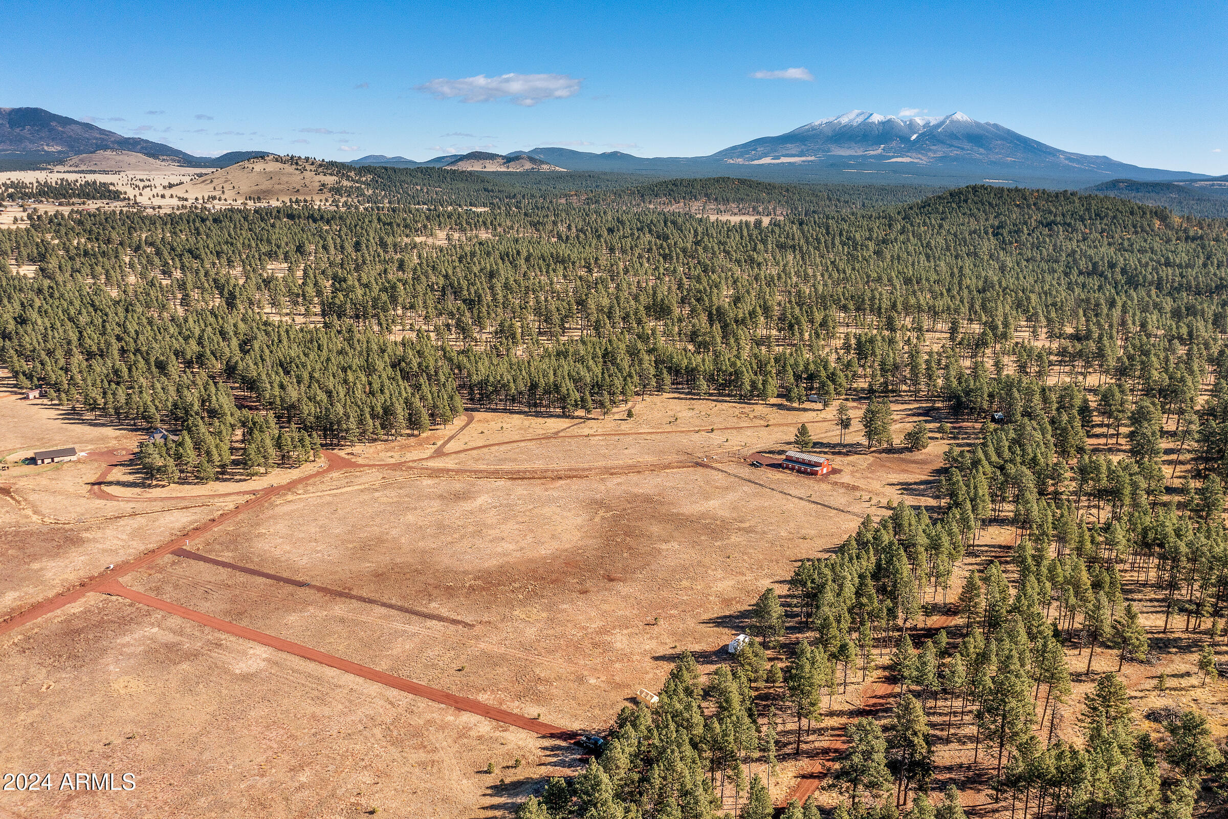 Discover the perfect retreat with this expansive 5.265-acre parcel of land, nestled in a serene and private setting. This unique property features open fields, providing ample space for your dream home, recreational activities, or agricultural pursuits. Backing onto a stunning national forest, you'll enjoy direct access to nature's beauty, making it an ideal location for outdoor enthusiasts.