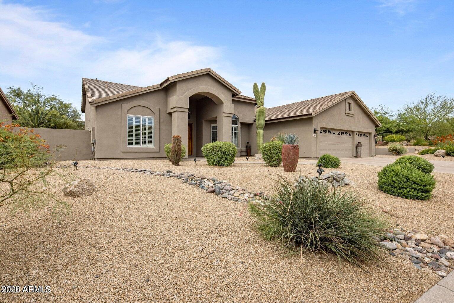Nestled inside the Balancing Rock community of Troon North, this 2,439 SF home is surrounded by the famous Troon North Monument Golf Course. This three-bedroom, two-bath, single-level, split floor plan home offers an abundance of natural light throughout with vaulted ceilings, wood shutters, wood tile floors, and a gourmet, double island, eat-in kitchen that is ideal for entertaining. In addition this home features brand new Trane AC Units,  new insulated garage doors. Plus both bathrooms have been fully updated. The master bath features an oversized walk in shower. The North-facing backyard includes a private pool that overlooks the natural desert open space providing a beautiful outdoor experience for those who love to entertain!
