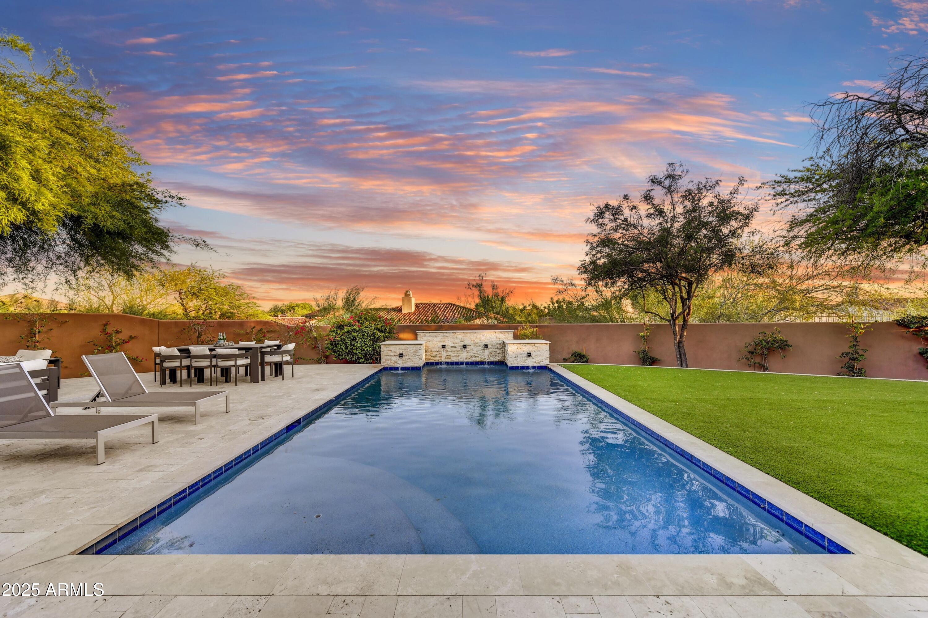 Back from sold, price slashed!! Phenomenal transformation remodel with finishes seen in 5 million plus range. Wow your friends and family with this one, designed for executive entertaining. Wide open floor plan with three sets of customized, easy to use glass panel doors. Super private living spaces in front, courtyard and rear yard. Carefully designed and upgraded to maximize every space. The flow from the open courtyard to the massive quartz island kitchen through the 18' wall of glass to the refreshing luxury pool is amazing. Oversized South yard looking East to the unobstructed McDowell Mtn. Views- Wow. Downstairs master retreat makes you never want to leave the bedroom. The second floor is complete with additional entertainment room en-suite and additional bathroom plus laundry, wow!