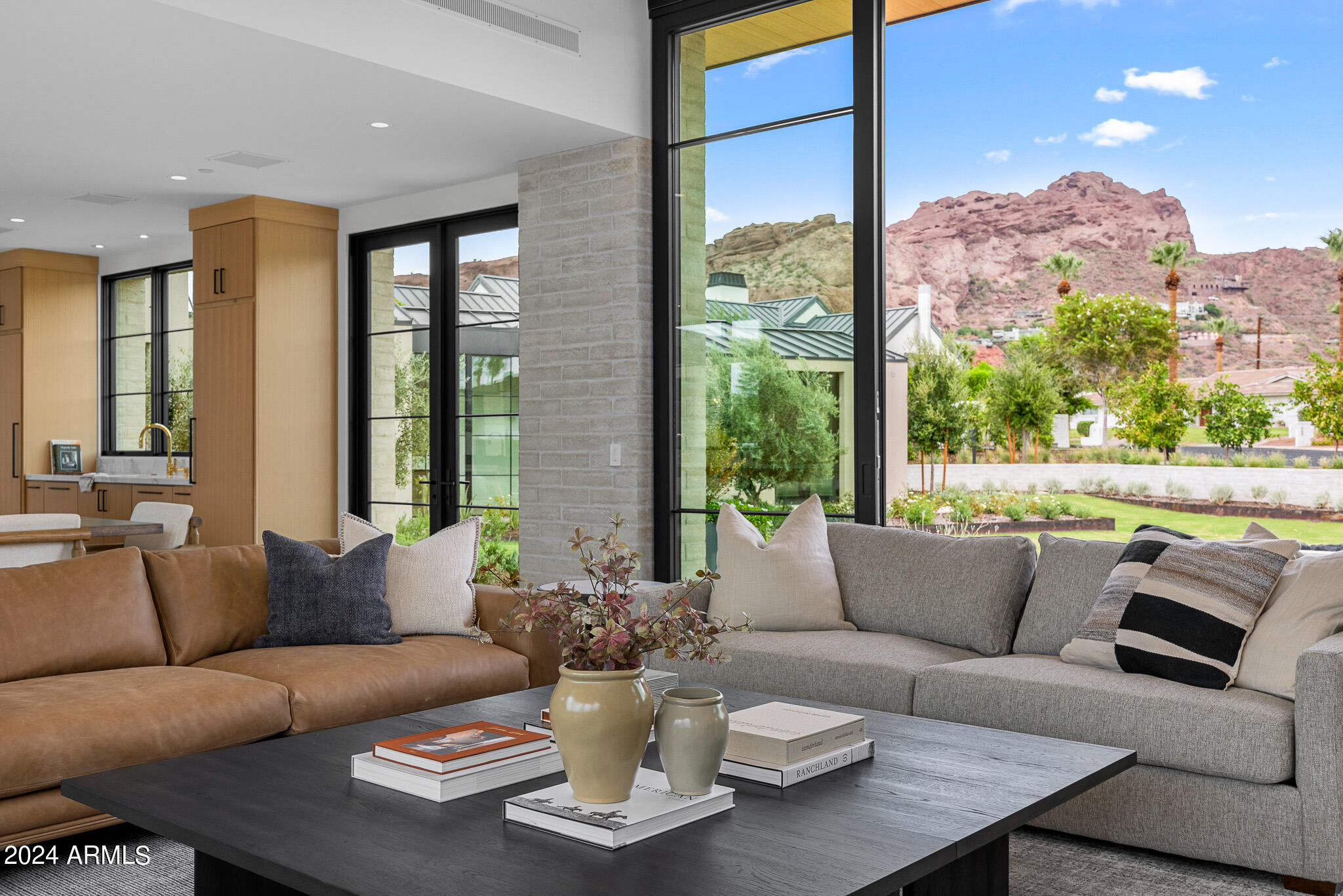MOVE IN READY...Discover Arcadia, where Vista General has crafted another gated masterpiece, designed by Matt Thomas Architecture, with interiors by NoMad Design and landscaping by Berghoff Design Group. This modern ranch home epitomizes luxury living, showcasing the stunning beauty of Camelback Mountain from its serene cul-de-sac location. Walls of glass, meticulous finishes, and lush grounds create an inviting atmosphere for you and your family. With 5 en-suite bedrooms, 6.5 baths, an office, game room, kids hangout, and bonus room, there's space for every lifestyle. Whether you're relaxingin the private heated pool/spa, BBQ and indoor/outdoor bar or entertaining guests, this brand new construction offers the ideal retreat in Arcadia. Do not miss out on this opportunity!