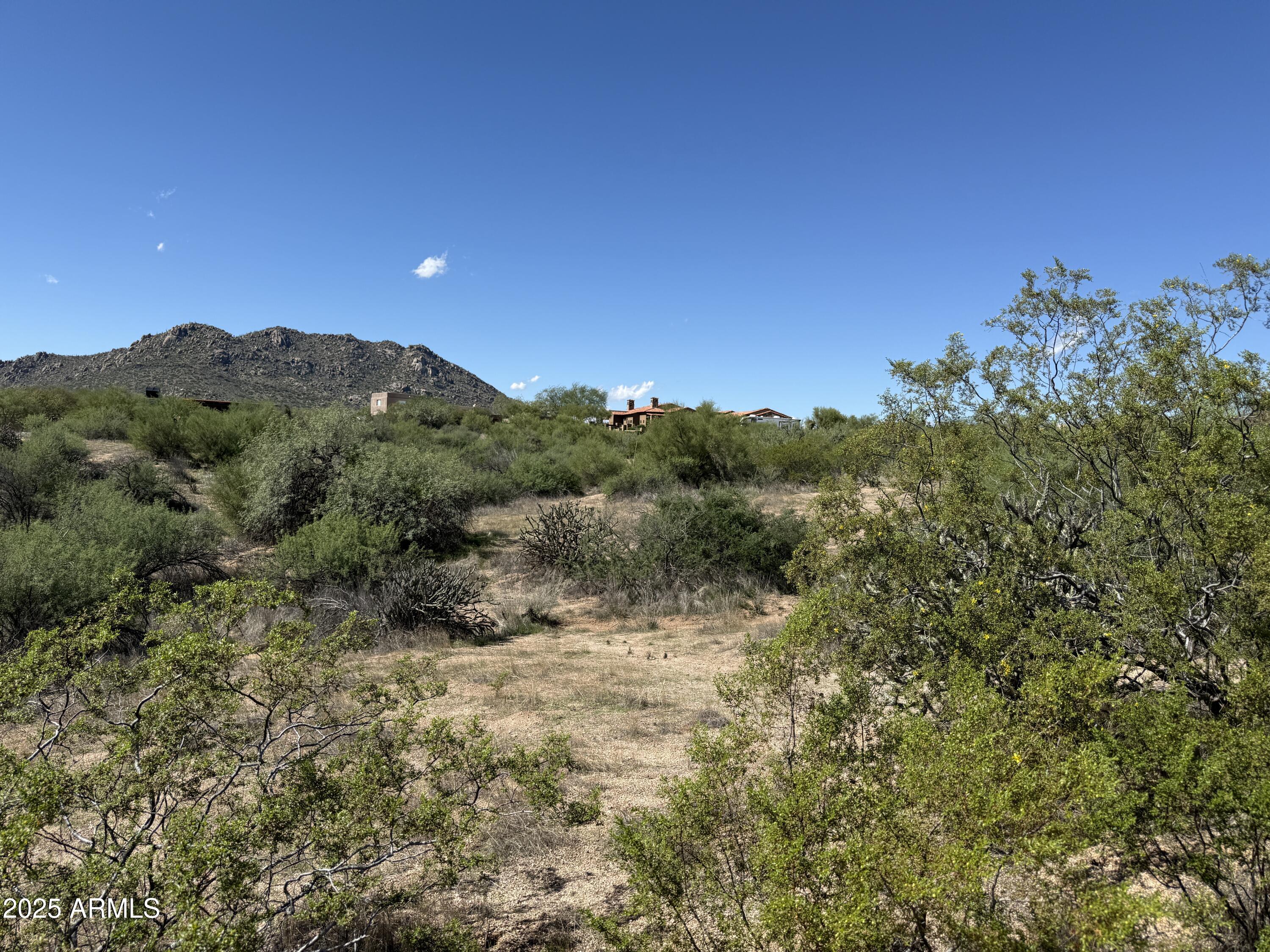 Gorgeous one-acre parcel with a shared well and endless possibilities! Located in the highly desirable Rio Verde Foothills, this property is lushly vegetated with classic Sonoran Desert flora. Enjoy breathtaking views of Four Peaks, the McDowells, and the Mazatzal Mountains. Surrounded by the natural beauty of the Tonto National Forest, McDowell Mountain Park, and the Sonoran Preserve—you're just minutes from horseback riding, mountain biking, hiking, off-road adventures, and kayaking on the Verde River. The gentle rolling terrain makes it ideal for a horse setup or custom home—a perfect blend of serenity and adventure!