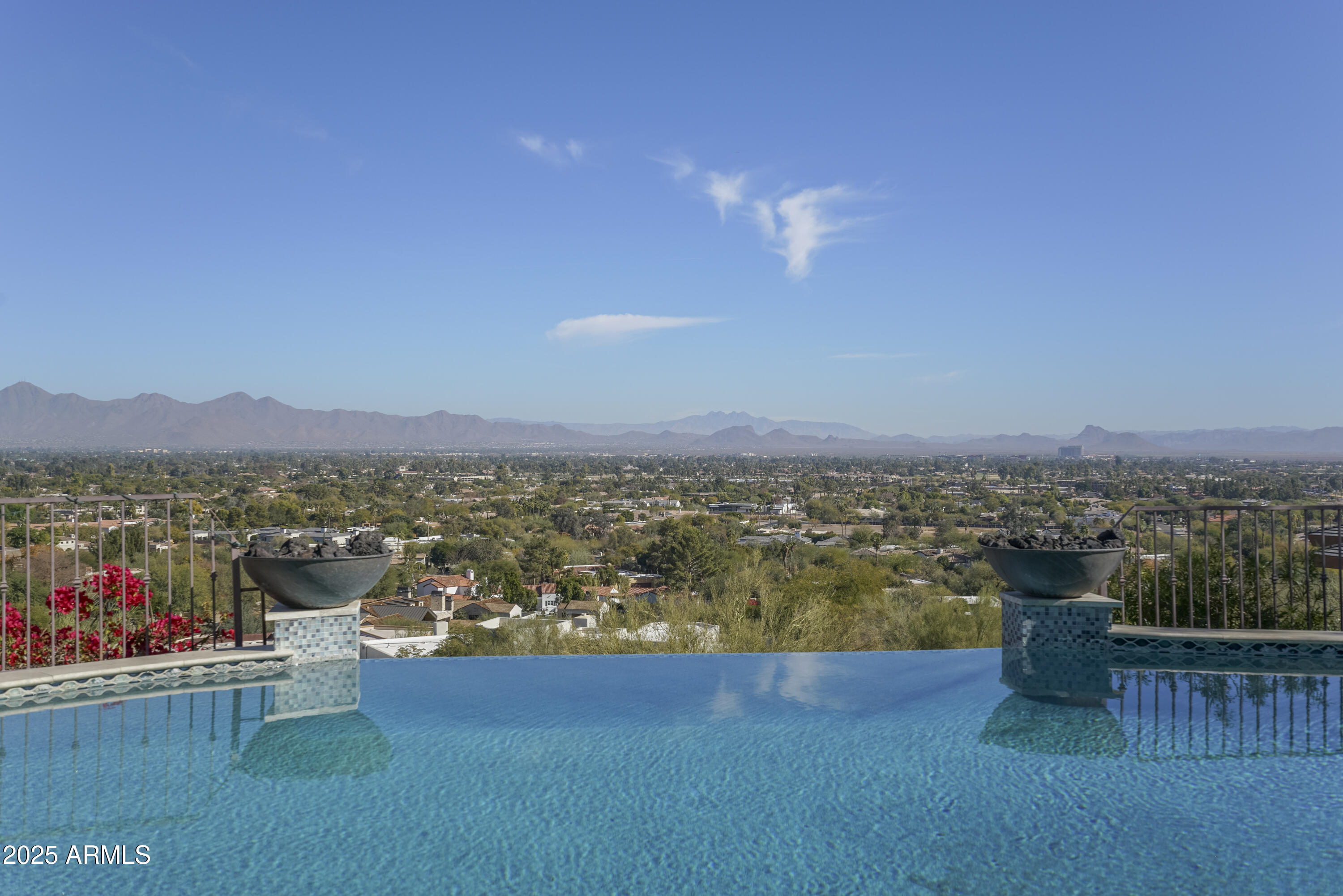 STUNNING 'LIKE NEW' MEDITERRANEAN STYLE CUSTOM HOME W/ SPECTACULAR CITY LIGHT & MTN. VIEWS IN EVERY DIRECTION! THIS EXQUISITE HOME FEATURES 6 BDRMS/8 BATHS/5 CAR GAR. W/ HIGHLY UPGRADED FINISHES & AN EXPANSIVE OPEN FLOOR PLAN! GOURMET KITCHEN W/ 2 MASSIVE ISLANDS, SUB-ZERO/WOLF APPL. PKG, MIELE COFFEE MAKER, REFRIG. DRAWERS, CUSTOM CABINETRY & 4 LG WSH/DRY. WALK-IN BUTLER PANTRY! OVERSIZED FAMILY RM. WET BAR & WINE CELLAR! MEDIA RM, GAME RM, OFFICE & EXERCISE. RM. LUXURIOUS MSTR BDRM SUITE W/ HIS/HER WALK-IN CLOSETS, HIGH-END CUSTOM BATHROOM CABINETRY & SHERLE WAGNER FIXTURES! SECONDARY BDRMS - ALL ENSUITE! SMART HOME & EV CHARGER! INCREDIBLE OUTDOOR SPACES W/ A HUGE COVERED PATIO. NEGATIVE EDGE PEBBLE-TEC POOL & SPA SHOWCASING MILLION $ VIEWS!