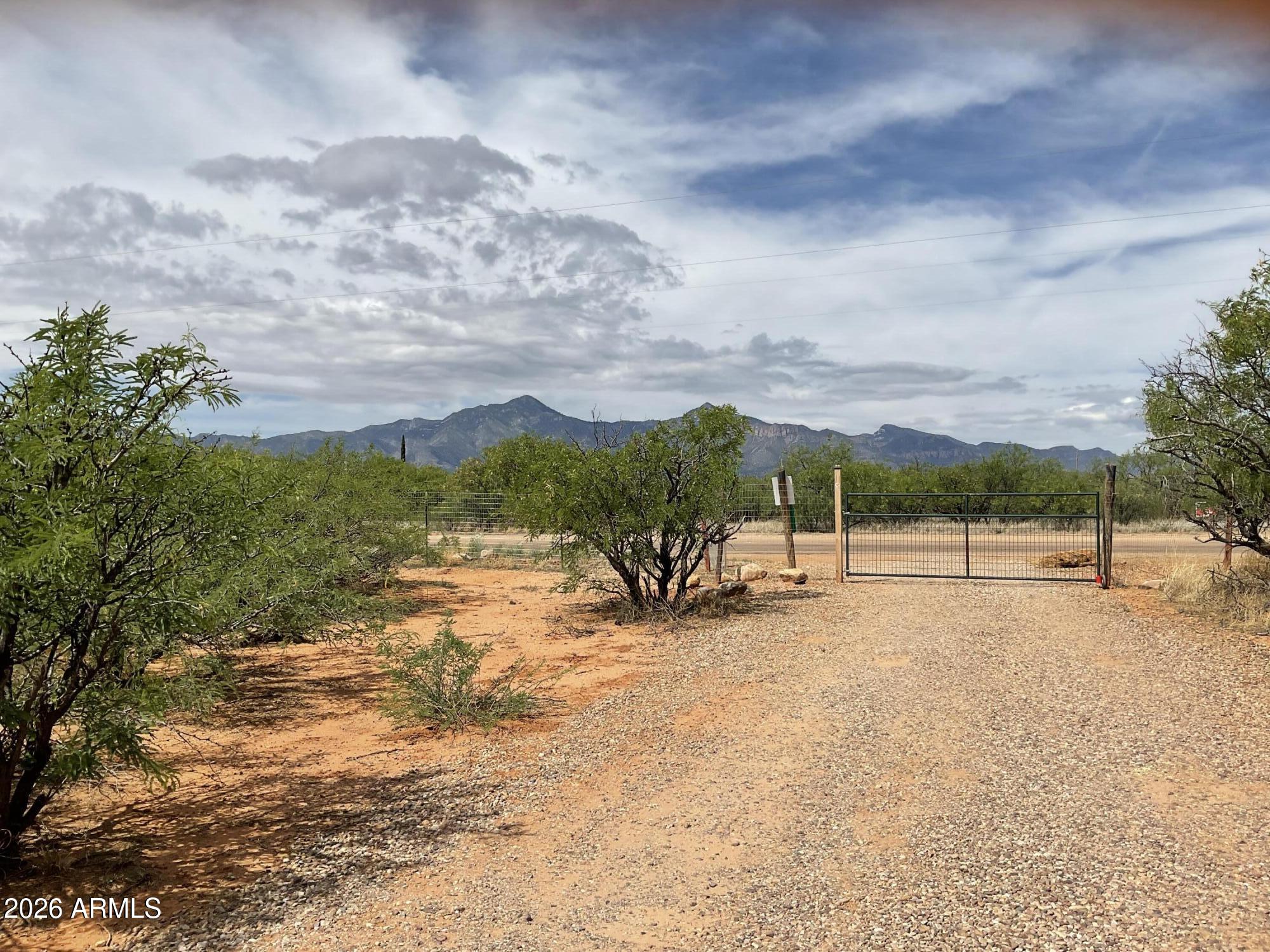Home is located on the center of 4-acres. The home is well hidden by indigenous plant live and has 360 view of the surrounding mountain ranges (Huachuca's, Dragoon, Mule Mountains) and view of the San Pedro River valley. The lots has plenty of available land to create a small ranch or fields of gardens. The entire property is fenced-in.