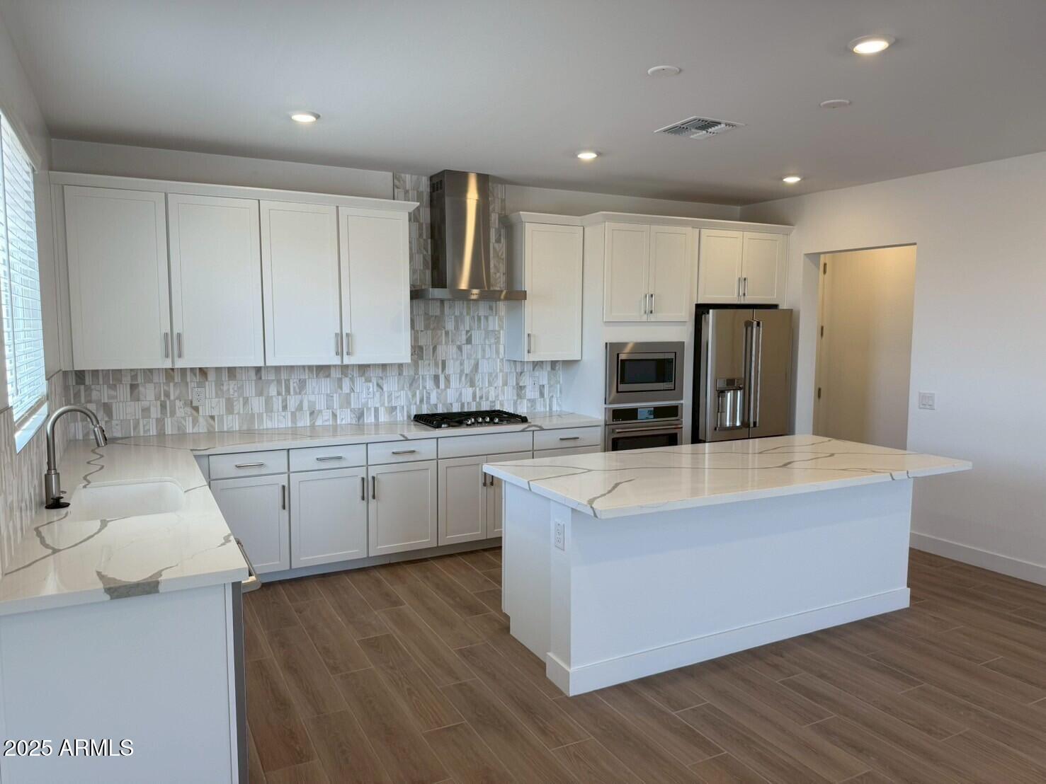 3 bedrooms, 2.5 bathrooms, and oversized 2-car garage. Primary bedroom features dual walk-in closets and a private deck. Upgraded design package - 42'' white cabinets, quartz countertops, tile backsplash, large island, GE appliances with gas range, upgraded sink, and tile flooring. Enjoy resort-style amenities, including a pool, clubhouse, courts, parks, playgrounds, and walking paths.