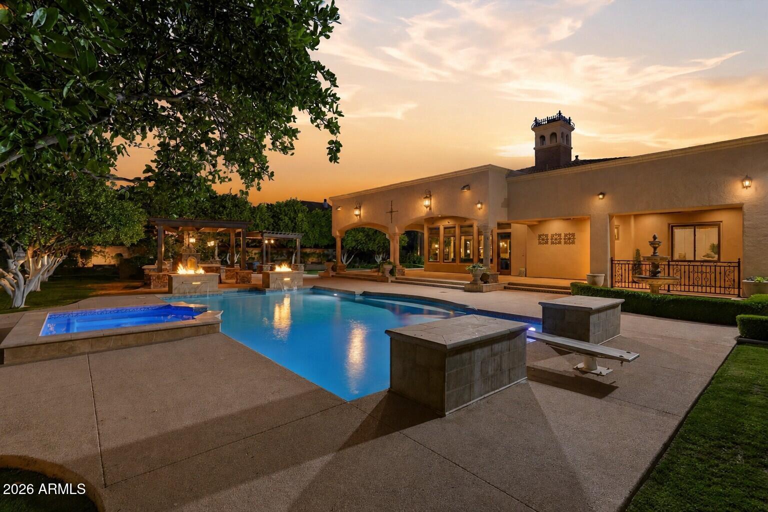 Welcome to the heart of Circle G. This custom estate features 6 bedroom, 5.5 bathroom with a rare combination of a 4-car garage plus dual RV garages & detached casita, designed for both everyday living and exceptional entertaining. Inside you'll find designer finishes that elevate every space including a stunning gourmet kitchen commanding the heart of the home, outfitted with a Viking & Thermador appliances, & dedicated prep kitchen. The finished basement is a movie lovers dream with a dedicated theater room. Step out to your resort-style backyard with a heated pool & spa, dual gazebos, built-in BBQ, and an outdoor fireplace beautifully lined by thriving citrus trees. A rare opportunity to own a one-of-a-kind luxury estate in one of Gilbert's most sought-after communities.