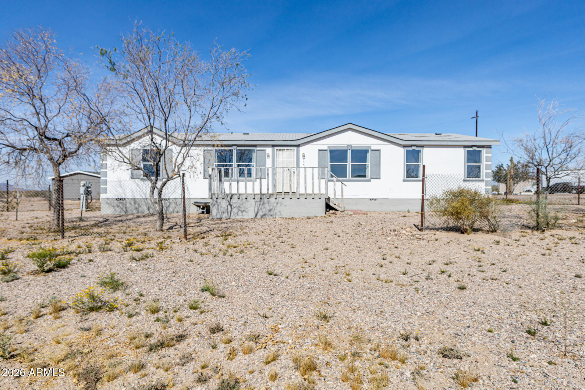 Experience the best of wide-open Arizona living with this charming Tonopah property, offering privacy, space, and potential. Set on a generous lot, there's plenty of room for horses, recreational vehicles, or expansion. Take in stunning desert sunsets and enjoy the tranquility of peaceful surroundings, all while maintaining convenient access to nearby amenities. The home features a functional layout with comfortable living areas and abundant natural light throughout. The nicely sized kitchen includes an island, microwave, and dishwasher, providing both practicality and convenience. Whether you're searching for a quiet retreat, an investment opportunity, or a place to create your dream lifestyle, this property offers endless possibilities. Home is being sold as-is, however; Seller may offer