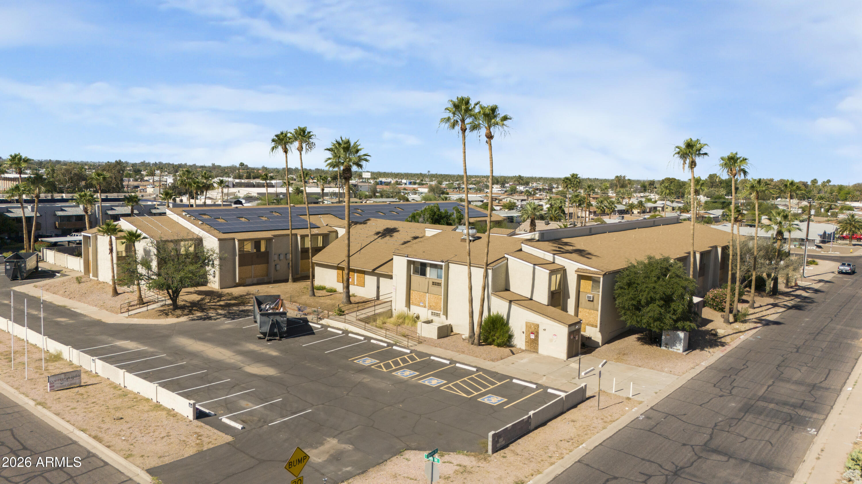 152 N 56th Street is a rare opportunity to acquire a 78 unit, ±61,969 SF building on 1.79 acres in the heart of East Mesa. Formerly Copper Heights Assisted Living, the vacant property is zoned R-5, permitting high density multifamily use.
Offered in shell condition following  interior demolition by prior ownership, the asset provides a clean canvas to reposition as multifamily housing, assisted living, behavioral health, memory care, or other compatible residential use. The two story building over a full basement features 78 units (30 one bedrooms and 48 studios) with private bathrooms, two large recreation and dining areas, partially intact basement commercial kitchen infrastructure, and rooftop solar. The site's expired Special Use Permit for licensed assisted living provides meaningful precedent for a new SUP.
Located in a rapidly growing East Mesa corridor with strong senior population growth and sustained rental demand, this is a rare large scale repositioning opportunity in one of Arizona's most supply constrained submarkets.