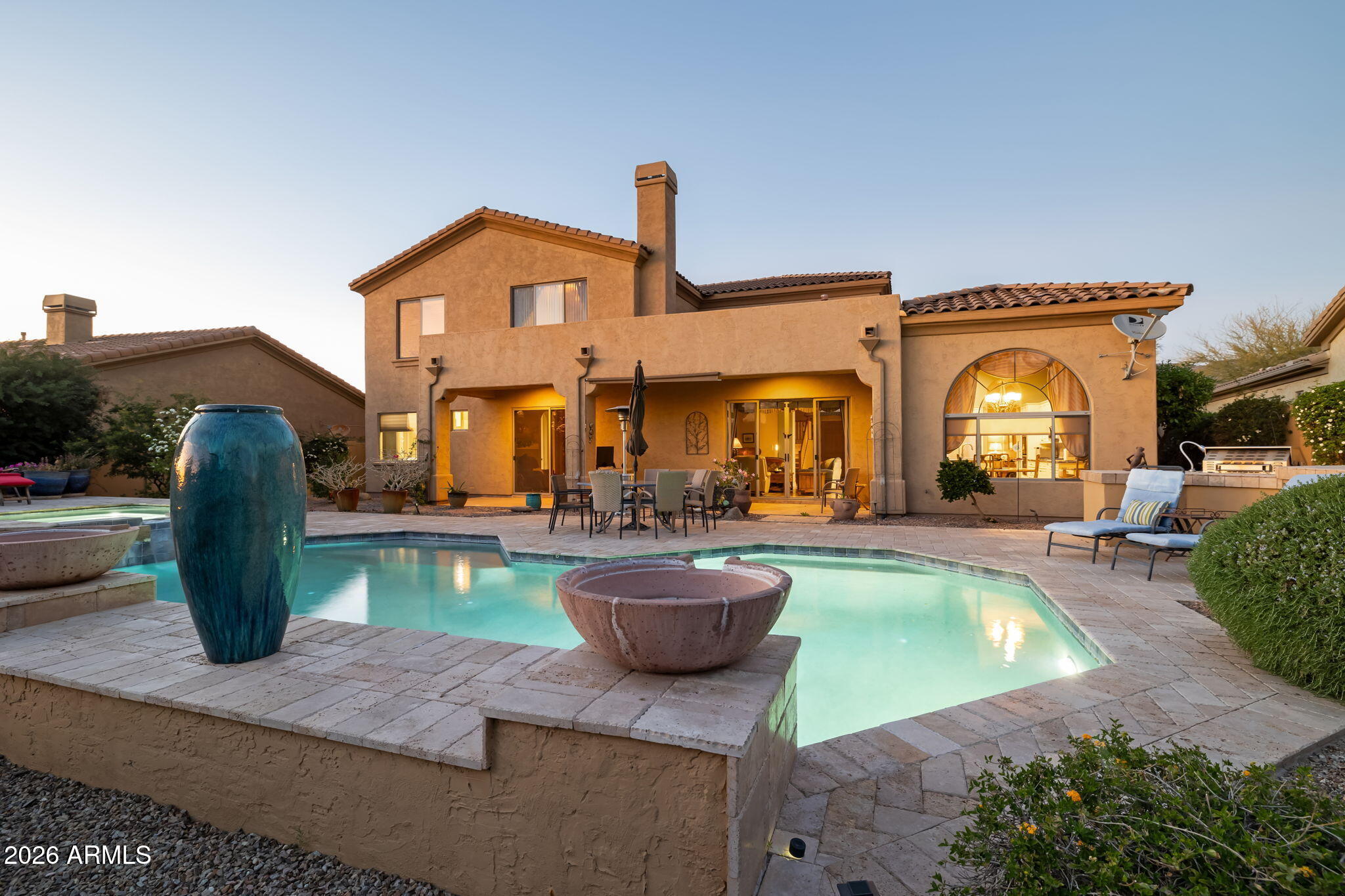 Gorgeous Toll Brothers Home offers a combination of Privacy, Elegance, &  Breathtaking desert Beauty. Backing to a Pristine Natural Preserve & showcasing front Views of the Superstition Mountains, the home delivers an exceptional Arizona Living Experience. Inside, refined craftsmanship & thoughtful design create a warm yet sophisticated atmosphere. The gourmet kitchen is a chef's dream, appointed w/ designer slab granite countertops, double ovens, stainless steel appliances, & a large center island w/ generous seating. Upgraded cabinetry & a large pantry provide both beauty & functionality--perfect for entertaining or everyday luxury. The open-concept family room features vaulted ceilings & a cozy gas fireplace that creates an  inviting focal point for gathering. Rich Brazilian Hardwood Flooring enhances the living room, dining room, primary bedroom, & den, while upgraded Tile flows throughout the great room, adding both elegance and durability.

The dramatic two-story foyer showcases an impressive staircase, creating a striking architectural statement upon entry. The formal living & dining areas offer ideal spaces for entertaining guests or enjoying quiet movie nights at home.

The main-level owner's retreat provides a private sanctuary, complete w/ dual walk-in closets & direct patio access leading to the sparkling pool & serene backyard landscape. The luxurious ensuite bath features upgraded cabinetry, designer flooring, & modern fixtures, along w/ a spacious walk-in shower & a relaxing garden soaking tub for the ultimate spa-like experience.

The first floor also includes a spacious den, convenient half bath,  & oversized laundry room with utility sink. Upstairs, the versatile loft provides a comfortable gathering space--perfect for relaxing, reading, or game nights. Four additional guest bedrooms & two full bathrooms w/ double sinks offer abundant space for family, guests, or hobby rooms.

Outdoors, the beautifully landscaped backyard invites relaxation beneath Arizona's endless skies. A sparkling pool & spa are surrounded by expansive travertine tile with a built-in BBQ, creating a stunning outdoor oasis ideal for entertaining or unwinding in peaceful desert surroundings. Backing to a tranquil preserve, the property enjoys privacy & unobstructed Sonoran Desert serenity. 
The spacious three-car garage provides ample room for vehicles, storage, & recreational equipment. Short distance to walking trails within the community. The Community features a Community Pool, Green Space & Walkable. Plus near Peralta Regional park, Hiking, ATV trails and Outdoor Recreation.
Blending timeless desert elegance with modern comfort & functionality, this Beautiful home captures the essence of luxury living in the Sonoran Desert.