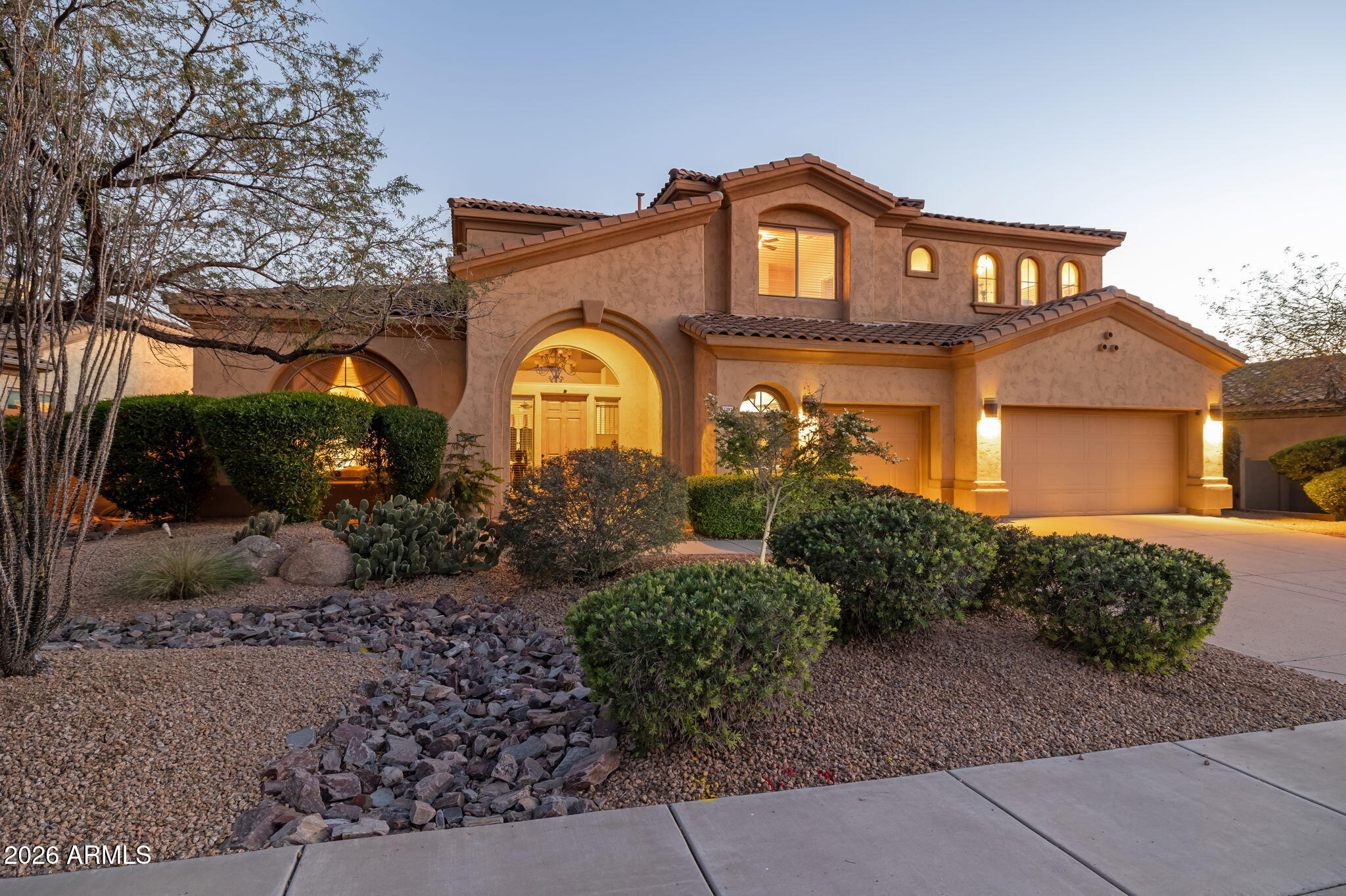 Gorgeous Toll Brothers Home offers a combination of Privacy, Elegance, &  Breathtaking desert Beauty. Backing to a Pristine Natural Preserve & showcasing front Views of the Superstition Mountains, the home delivers an exceptional Arizona Living Experience. Inside, refined craftsmanship & thoughtful design create a warm yet sophisticated atmosphere. The gourmet kitchen is a chef's dream, appointed w/ designer slab granite countertops, double ovens, stainless steel appliances, & a large center island w/ generous seating. Upgraded cabinetry & a large pantry provide both beauty & functionality--perfect for entertaining or everyday luxury. The open-concept family room features vaulted ceilings & a cozy gas fireplace that creates an  inviting focal point for gathering. Rich Brazilian Hardwood Flooring enhances the living room, dining room, primary bedroom, & den, while upgraded Tile flows throughout the great room, adding both elegance and durability.

The dramatic two-story foyer showcases an impressive staircase, creating a striking architectural statement upon entry. The formal living & dining areas offer ideal spaces for entertaining guests or enjoying quiet movie nights at home.

The main-level owner's retreat provides a private sanctuary, complete w/ dual walk-in closets & direct patio access leading to the sparkling pool & serene backyard landscape. The luxurious ensuite bath features upgraded cabinetry, designer flooring, & modern fixtures, along w/ a spacious walk-in shower & a relaxing garden soaking tub for the ultimate spa-like experience.

The first floor also includes a spacious den, convenient half bath,  & oversized laundry room with utility sink. Upstairs, the versatile loft provides a comfortable gathering space--perfect for relaxing, reading, or game nights. Four additional guest bedrooms & two full bathrooms w/ double sinks offer abundant space for family, guests, or hobby rooms.

Outdoors, the beautifully landscaped backyard invites relaxation beneath Arizona's endless skies. A sparkling pool & spa are surrounded by expansive travertine tile with a built-in BBQ, creating a stunning outdoor oasis ideal for entertaining or unwinding in peaceful desert surroundings. Backing to a tranquil preserve, the property enjoys privacy & unobstructed Sonoran Desert serenity. 
The spacious three-car garage provides ample room for vehicles, storage, & recreational equipment. Short distance to walking trails within the community. The Community features a Community Pool, Green Space & Walkable. Plus near Peralta Regional park, Hiking, ATV trails and Outdoor Recreation.
Blending timeless desert elegance with modern comfort & functionality, this Beautiful home captures the essence of luxury living in the Sonoran Desert.