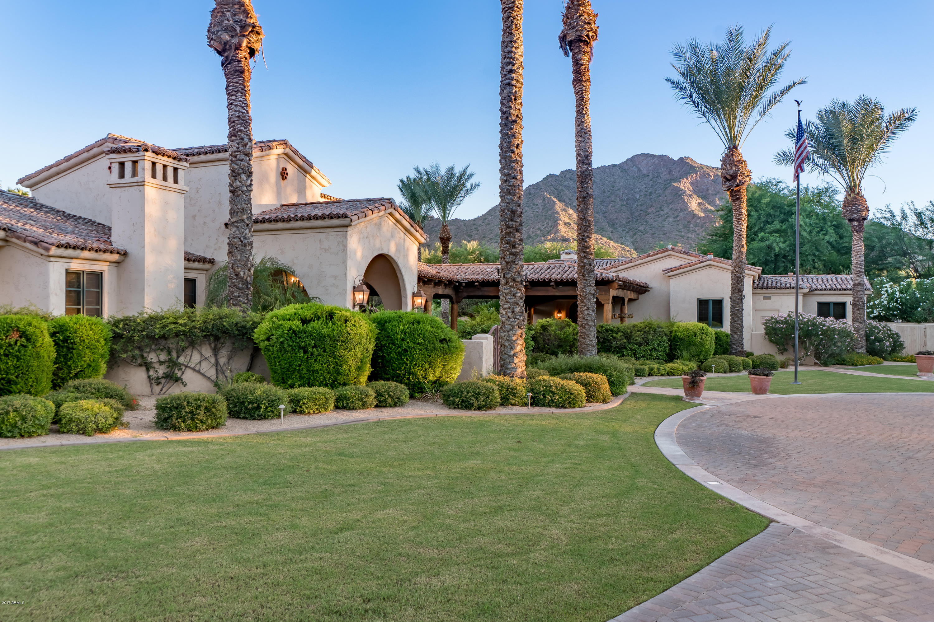 This one of a kind Custom Estate sits on nearly 2 acres of one of the most sought after and desirable real estate in all of Paradise Valley: the coveted ''Gold Coast,'' centered between Mummy Mountain & Camelback Mountain with dramatic views of both. Extras include a 1,500 bottle temperature controlled wine room, custom theater, fully stocked game room with pool table & bar. Detached 1,186 SQFT Guest House, with full kitchen, living room, bedroom and a private Spa. Topped off by the sumptuous grounds that are sure to leave you speechless, with a true resort style pool & spa, complete with multiple waterfalls, abutting a Pool Cabana complete with full kitchen, large bar sitting area, BBQ, 2 separate bathrooms, and a storage closet. All furnishings available under separate bill of sale.