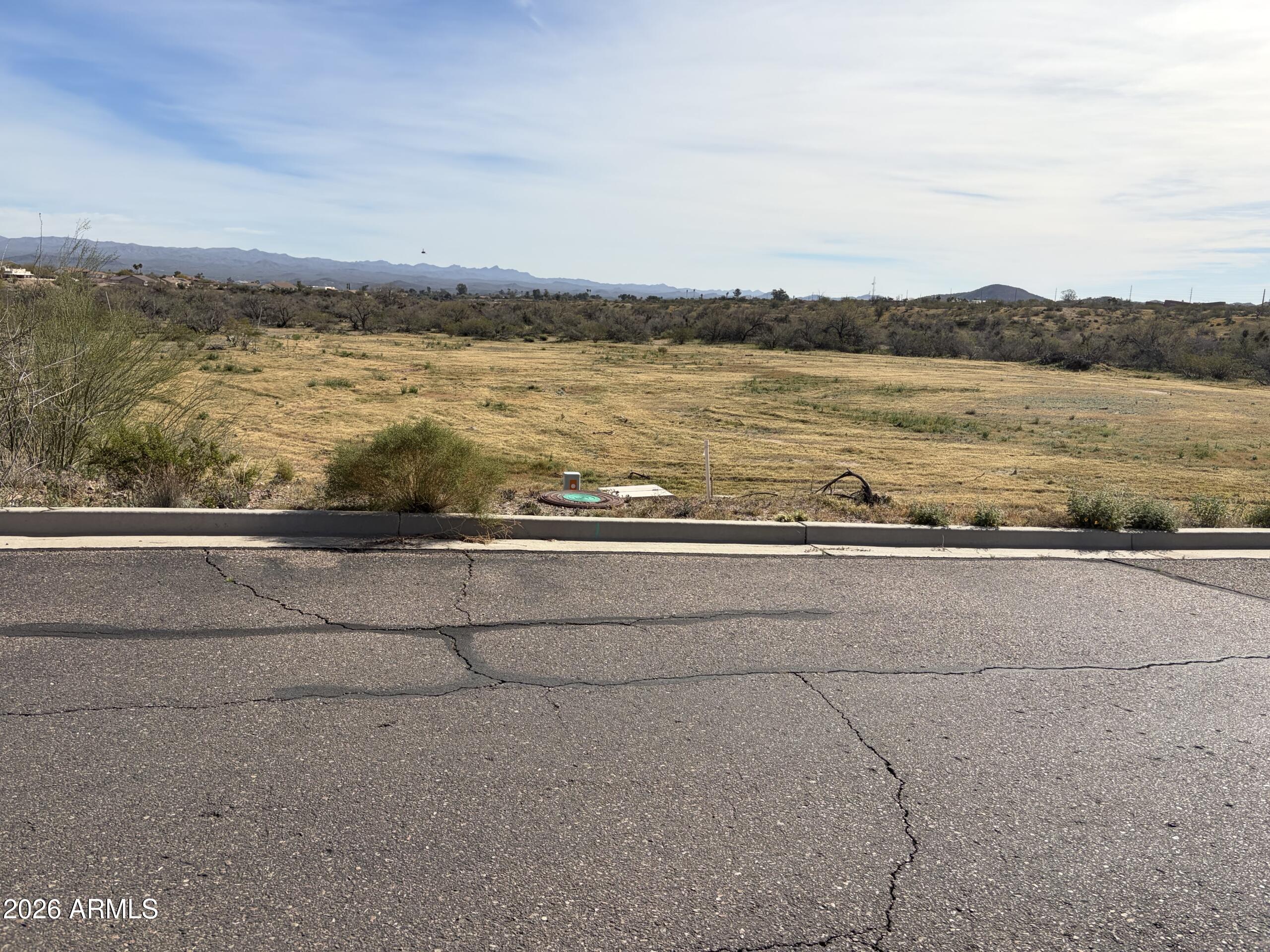 PRESTIGIOUS THREE CROSSES  COMMUNITY BUILDING LOT

Looking for a great lot in an area of custom homes on paved streets? Look no further than Three Crosses Lot 60! Slightly under 2ac with mountain views. Very nice level lot for what should be a nice easy build. CC&R's protect the integrity of the neighborhood without any HOA fees. Paved streets with all utilities either on the property. Walk the lot today! Brand new home currently going up next to the lot demonstrates value of the property.  Owner has other nearby lots available as well.  Owner is a builder and can also offer a build job or you can buy lot outright.