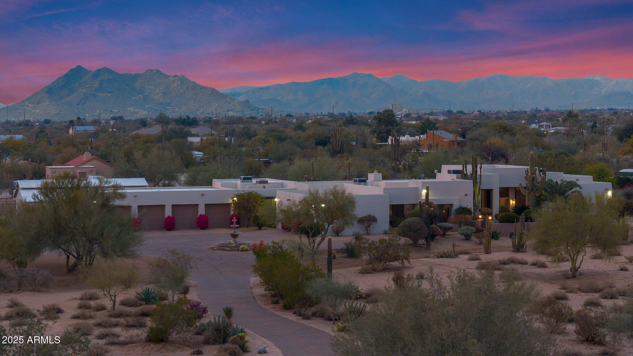 Step into a world where luxury, leisure, and your passions intertwine—this one-of-a-kind, 5-acre equestrian estate offers not just a home, but a lifestyle. Newly remodeled in 2024, this stunning residence captivates even the most discerning buyers.  Imagine waking up to serene mountain views, where nature's tranquility greets you. The home's seamless flow around a shimmering pool creates a peaceful retreat. The spacious, open-concept kitchen is a chef's haven, with custom cabinetry, a large island that's perfect for gatherings, and a cozy fireplace that invites intimate moments in the great room. The main house offers four oversized en-suite bedrooms with walk-in closets, creating private retreats for family or guests. An additional 940 square foot Casita | Pool House with Workout Room, separate entrance, living space, bedroom, and 2 full baths offers limitless possibilities whether you're looking for a multi-generational home, a private guest suite, or a place to relax in style poolside. The versatility of the space means you can curate your lifestyle to suit your needs. The Detached Guest House offers comfort and privacy with a full kitchen, living space, 2 bedrooms, and 2 full baths ideal for family or friends.  
Equestrian lovers will be in awe of the paddocks, barn with six stalls, two tack rooms, and an expansive riding arena. This property celebrates your love of horses and all things equine.
Car collectors will find their dream space in the seven extended-length, over-height garage bays with an abundance of storage. A sanctuary for your cars, toys, or projects, this space is perfect for showcasing your prized collection.
This estate offers privacy, comfort, and the perfect balance of nature and luxury. A true dream, it caters not only to equestrian lovers but also to car enthusiasts and hobbyists, providing the ideal space for all passions with room to expand.  This home is more than just a property. it's where dreams come to life.