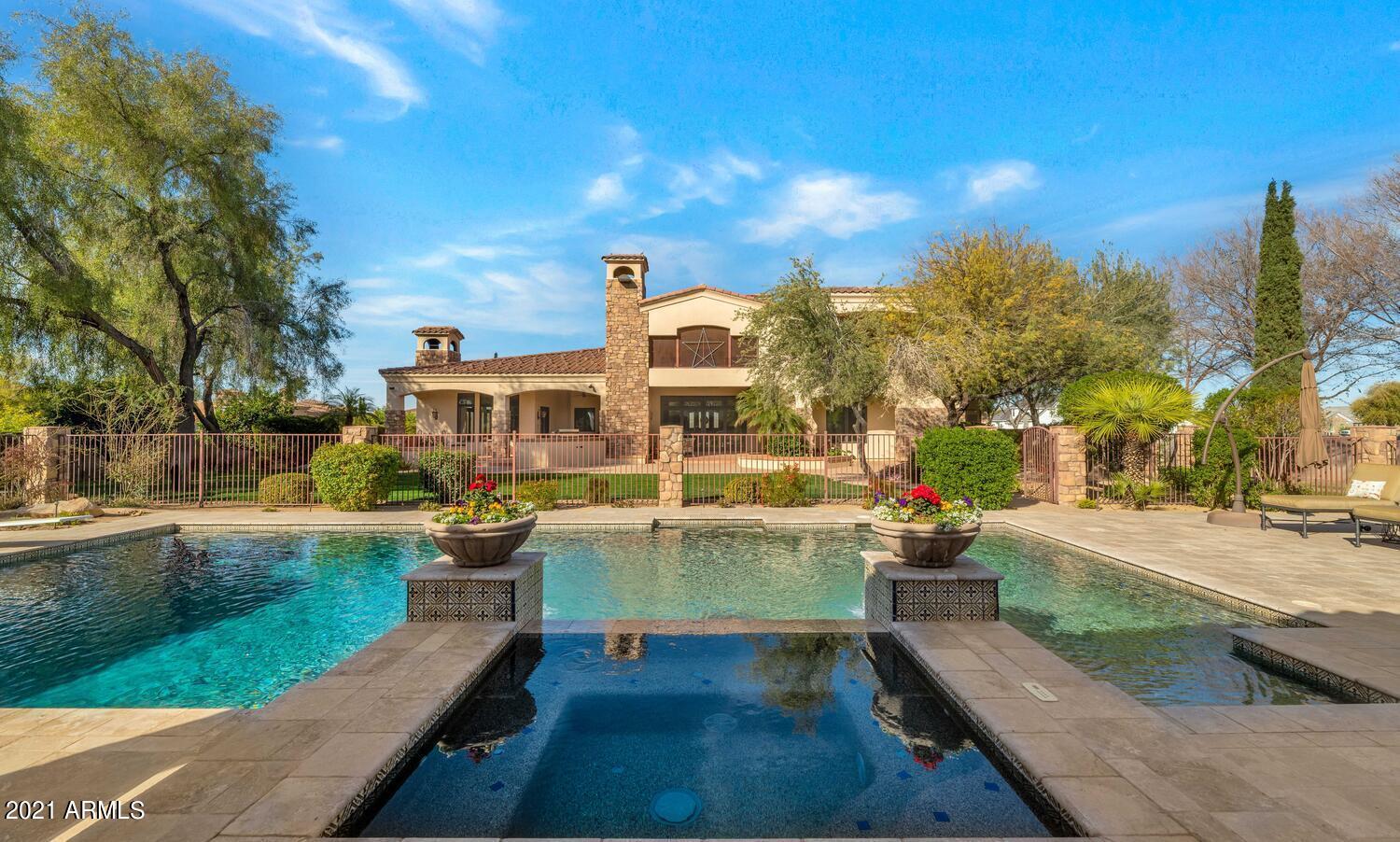 Paradise Found!  From the moment the private drive gate opens you realize that you are in a special place.  Driving down the tree lined drive takes you back 2 acres to a large resort style pool equipped with a diving and slide area as well as bench seating and a large cabana area.  It is then that you notice the home ... stately and somewhat Santa Barbara.  Not a trendy home, but something totally unique.  As you drive past the home to the auto court the rest of the property is revealed. It is possible to live in luxury and benefit from a farmette lifestyle.   There are 6 large bedrms all with ensuites  and walkin closets plus three powder rooms.  Don't miss the 7 car garage and the solar panel field (it is owned) that produces so much power elec bills average apprx only $225/month !! Once you enter the front door you are struck with the grandness of the front room with 20-foot beamed ceilings, a bar area looking straight through to the back yard and gorgeous resort style pool area.  The gourmet kitchen is a home chef or busy moms' dream.  It is equipped with double sinks, 2 dishwashers and double ovens, a warming drawer, ice maker, separate subzero refrigerator, and freezer, as well as a two-drawer snack refrigerator and an in-wall coffee maker.  The pantry is huge with saloon doors opening for hands free entrance and exit. The home has 3 levels with the main floor including 4 bedrooms, double desk area for studying, grand living room, kitchen, family room, mudroom, and the most spacious laundry/craft/sewing room/office you could ever need.  It is 250 square feet with a 9x3.5-foot island for massive amounts of laundry or laying out yards of fabric.  The double stacked washers and dryers make laundry day a breeze.   Each spacious bedroom has its own full bath with granite countertops and walk-in closet. 
As you take the beautiful wrought iron staircase upstairs you will find a full master suite and private home office with beautiful built-in cabinets. The loft is an excellent place to enjoy a nice book or a sunset view.  The master bedroom is truly a retreat with its own patio deck overlooking the pool.  Many beautiful sunrises will be enjoyed from this spot.  It is equipped with a fireplace a large, jetted tub, 2 head shower and double vanities, and a large custom closet.  
 This home has a 24KW solar system creating a huge electricity savings. The back pasture is large enough for multiple varieties of livestock.  There is a 30x45 pole barn with tack room and multiple stalls where animals can be shaded.  Between the large field, the 4 5x20 raised garden plots, and 17 fruits trees (over 80 trees in all), it is quite possible for a family and more to be food sustainable.  The basement touts a 350 square foot storage room perfectly suited for any type of temperature-controlled storage whether it be food or holiday decor.  No need for attic space, this home has mass amounts of storage.  
The bright and large "walk-out" basement is home to "all things" entertaining:  Twenty-six hundred square feet of family fun  opportunities.  Step out to an open and bright patio, Diner style kitchenette with banquette table seating.  It is a favorite late night movie spot that pairs beautifully with the 9-seat movie theater.
Parking is never a concern with the oversized 3 and (possibly 4) car garage with a level 2 electric car charger.  The second garage has 4 car/toy/equipment/workshop capability   There is also shaded 2 car parking spots. 
Some other interesting features include gorgeous reclaimed barnwood floors on main level grand areas, stairs and office, Lutron lighting control system, automated window coverings in all rooms, misting system on the back patio, Pella wood windows a zipline and so much more.  
The west 1.25 acre parcel is a separate parcel and is included in the total sq. footage of 202,301 sq. feet.