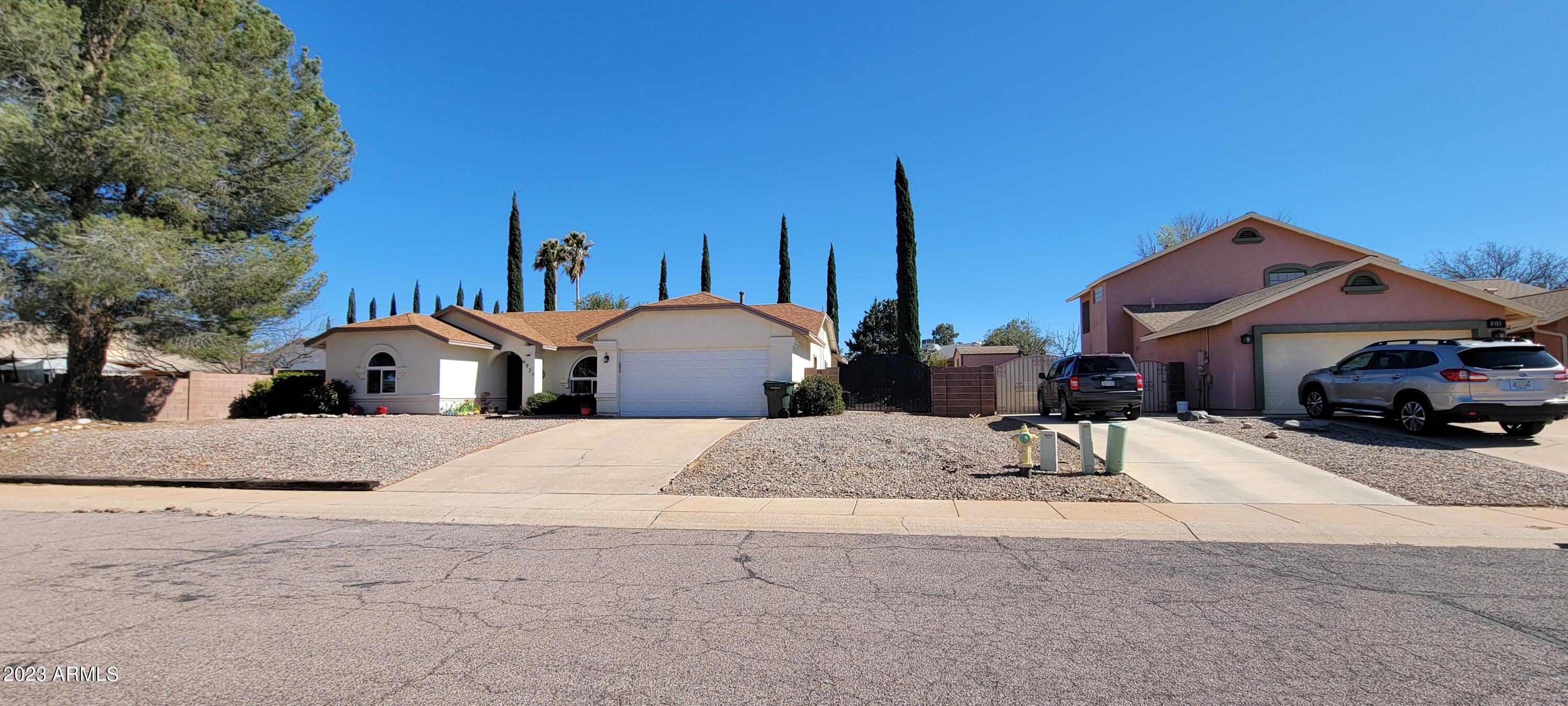 This adorable home is move in ready. There is a great room type floor plan and a nicely arranged kitchen with quite a bit of counter space. The master suite is beautiful with a new door out to the back covered patio. You will love the new vanity in the master bath too. there is an ample walk in closet and there is also what could be a 4th bedroom, or office with a closet. On the opposite side of the home are the rest of the bedrooms and very cute main bath. All of the appliances stay including the new dryer and older washer. The back yard is tiered to make it very usable with a built in bench and firepit for the cool evenings or smores! There is also room for a garden. There is an RV gate and secure RV parking as well. Do not miss this one!