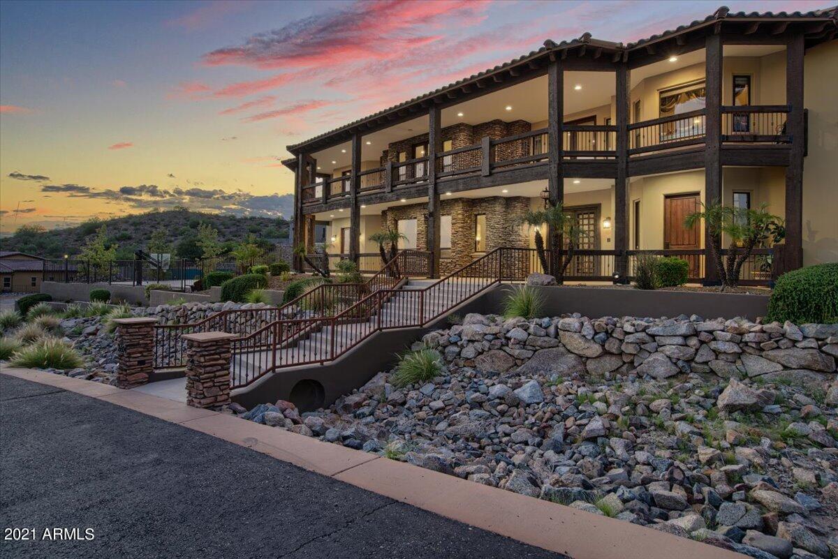 An elegant masterpiece on 2.3 acre of Mountain Side, come to your serene, private sanctuary and create memories for life. Immerse yourself in peace, tranquility and luxury, you will fall in love with the house the moment you step in. No expense was spared in building this dream.  Over 9,000 square feet 5 Bedroom 7 Bath this  home boasts a stunning grand entrance, large rooms with finest architectural  finishes throughout and a floorplan that is formal, creates inviting ambience. As you step out to your private resort, outdoor kitchen, gas firepit, exquisite pool in the back, basketball court waiting for you to make this your home. Sit back and enjoy city lights from the front porch or go on back balcony to enjoy mountain views, AZ living at best. Has a Huge RV Garage for all your Toy