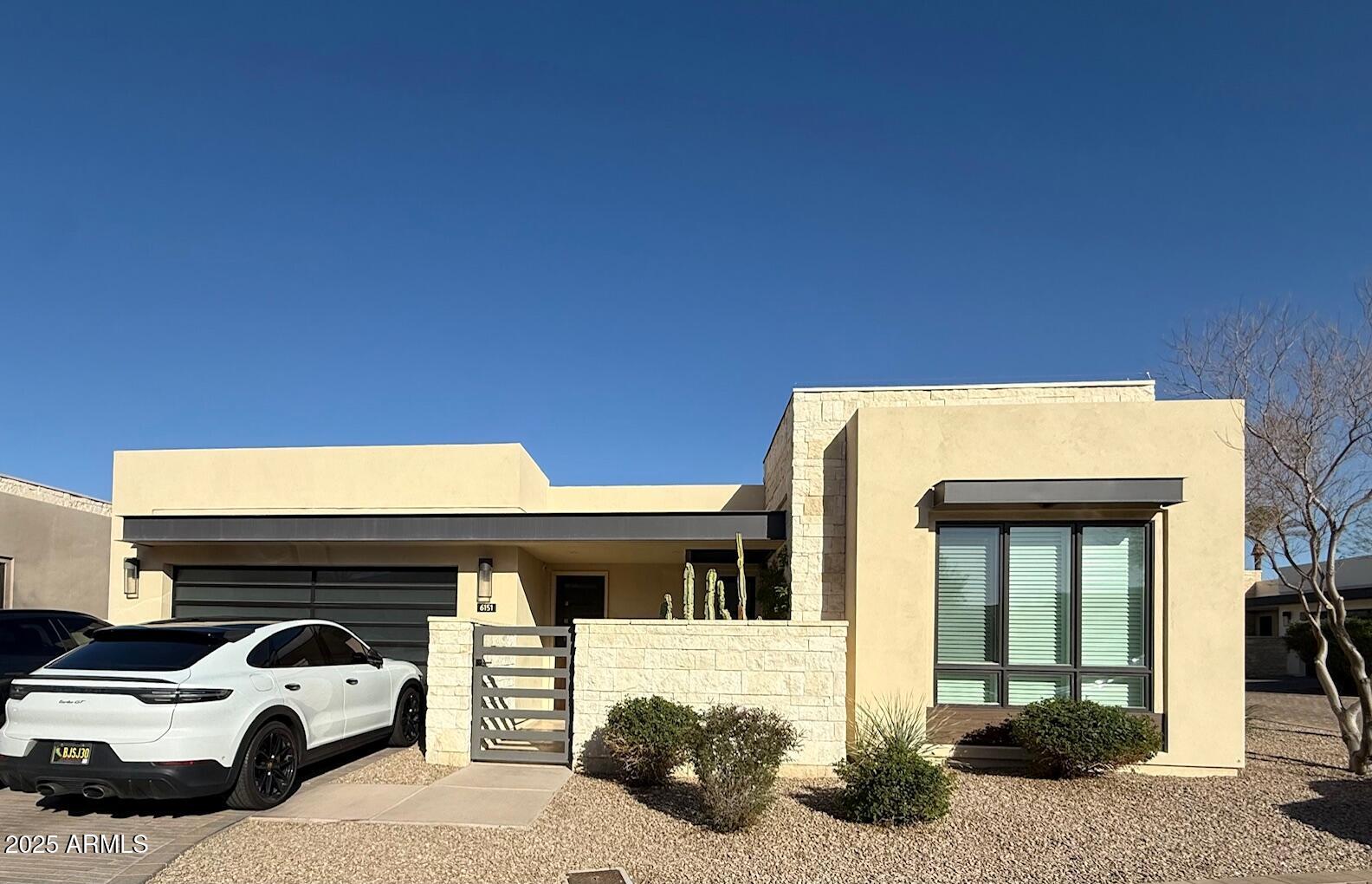 Luxury home at Mountain Shadows Resort in Paradise Valley.  At the foothills of Camelback Mountain, this single level home has a distinctive architectural design and indoor outdoor living style. Sierra Pacific 9' bi-fold doors, smart home customized Savant systems, 12' ceilings in the great room, luxurious designer features including Wolf  gas cooktop, steam and wall ovens, 48'' SubZero refrigerator freezer, custom floor plan, Taj Mahal countertops, limestone floors, indoor and outdoor fireplaces, Energy 
Star rated, with 24/7 guarded gate.