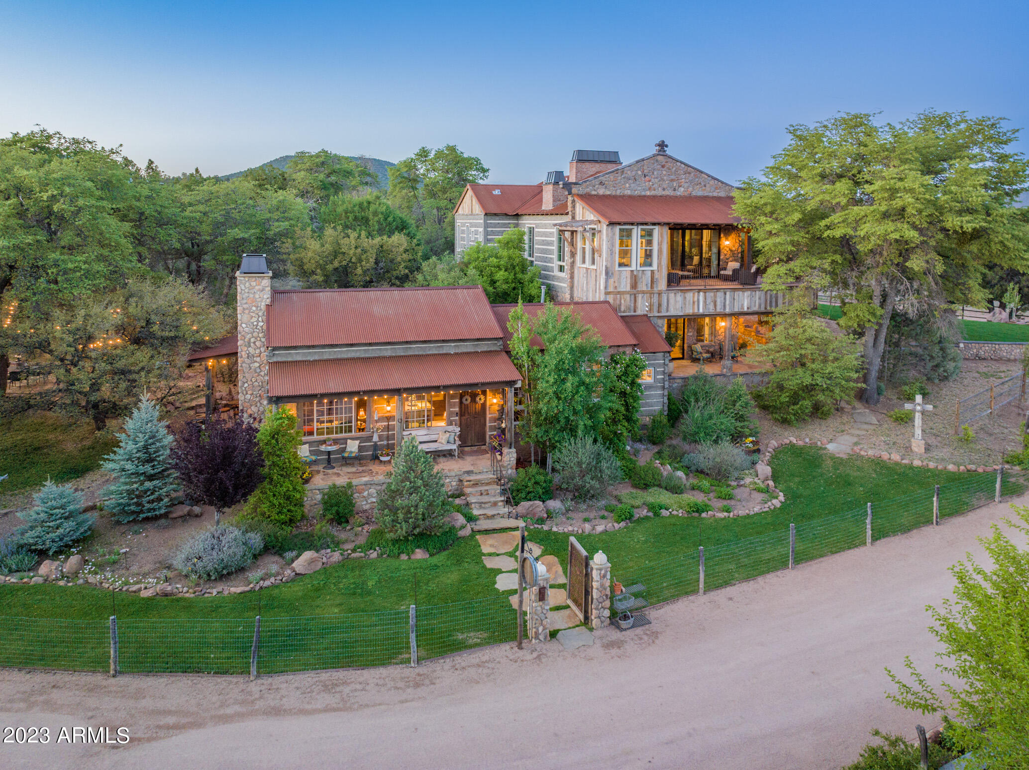 Once in a Lifetime Opportunity!  
Welcome to this stunning property in the high country of Arizona where an exceptional 14 acre working vineyard awaits you.
Boasting a rich history, this property has served as a highly acclaimed bed and breakfast, catering to discerning guests seeking an unforgettable retreat. Every detail of this remarkable estate has been crafted with the utmost care and highest quality. From the stunning vineyard to the thoughtfully designed living quarters, no expense has been spared in creating an atmosphere of refined elegance. Within the estate, you will find three separate living quarters, each offering its own unique charm. The first residence features two spacious bedrooms and two full bathrooms, ensuring luxurious comfort for its occupants. The Guest House offers a cozy haven with two bedrooms and a shared bathroom, inviting tranquility and relaxation. Completing the ensemble is the garden house, a delightful one-bedroom, one-bathroom sanctuary nestled amidst the captivating surroundings.

In addition to the vineyard and living quarters, the property encompasses 1.5 acres of fenced pastured land, perfect for grazing animals. The property also holds multiple areas for gardening.  One was designed with beautiful raised stone beds and the additional gardens are located within the vineyard, all fenced. This expansive estate presents endless possibilities for those seeking a sustainable lifestyle immersed in natural beauty. Should we mention two high producing water wells and a completely irrigated property? Loads of fruits trees too!!

Experience the perfect fusion of rustic tranquility and exquisite craftsmanship at this extraordinary Young, AZ vineyard. Whether you continue its legacy as a bed and breakfast or transform it into your private sanctuary, this property promises an unparalleled living experience. Indulge in the finest quality and embrace a life that blends sophistication with the beauty of nature. The opportunity to call this vineyard retreat your own awaits you.