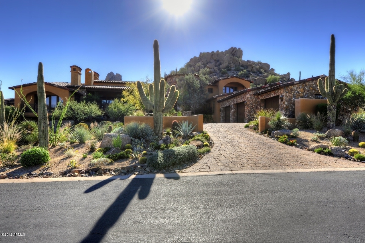 Perched high above the 16th tee of the world renowned Estancia Golf Course. This house offers unobstructed, expansive views on a private cul-de-sac lot.  Spectacular Tuscan designed home where no detail has been overlooked. The superior finishes include reclaimed Hickory floors, Venetian plaster walls, heavy wood beams together with unique ceilings that bring out the true flavor of the old world. Enjoy outdoor living at its best on a wonderful covered patio with mountain views. This 7,200+ square foot home includes private guest quarters with sitting area and second master suite. Estancia club membership available subject to board approval, not included in purchase price. Please bring all offers!! Furniture available for sale separately.