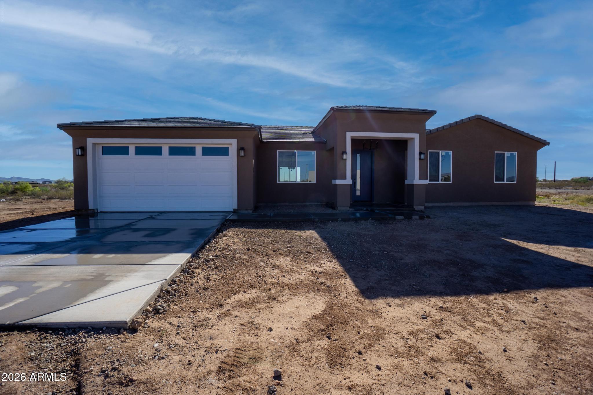 Stunning brand-new home on a 1.2-acre lot with mountain views! Extended driveway with extended 2-car garage. Foam insulation. Inside, discover a bright, open layout w/ 9 ft ceilings, large ceiling fans,  recessed lighting, wood-look tile flooring, 8 ft doors  & neutral paint. Enviable kitchen boasts high-end Samsung appliances, generous cabinetry & counter space & a breakfast bar island w/elegant pendant lighting. Main bedroom offers a walk-in closet & a private bathroom featuring dual sinks & a modern tiled shower. The additional bedrooms and second bathroom perfect for family or guests. Both baths w/ LED lighting. The 1.2 acre lot leaves plenty of room for endless opportunities to make this ranch your own. The covered patio calls for sitting and enjoying the awesome views. Welcome home!