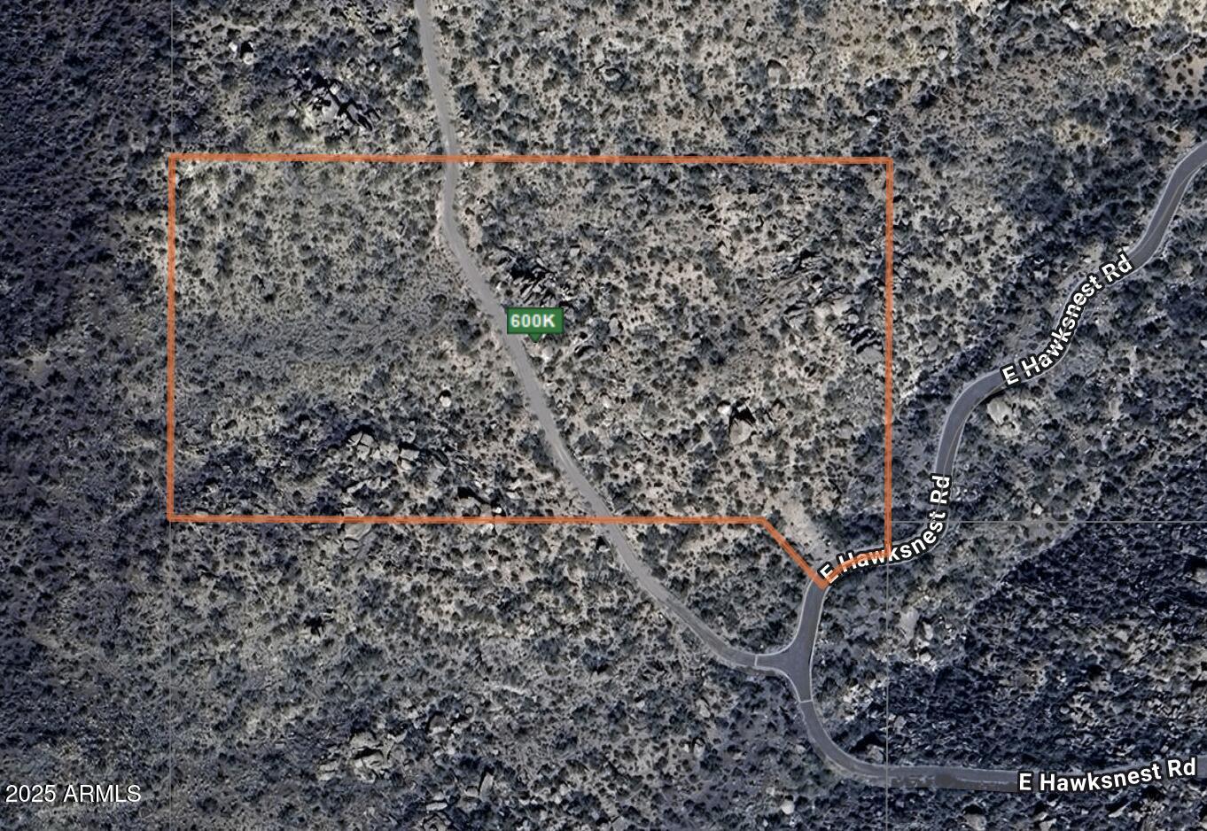 This exceptional 5.10-acre home site on the north slope of Black Mountain offers a serene and elevated setting in the prestigious, gated Hawksnest Subdivision. The gently sloping building site, adjacent to preserve land, provides easy access and incorporates a signature boulder into the design, surrounded by breathtaking views of the Continental Mountains, Elephant Butte, Skull Mesa, and Apache Peak. With paved roads and utilities on-site, this property offers high-quality, low-density living just minutes from golf, shopping, dining, and the charming towns of Carefree and Cave Creek, making it the perfect retreat.