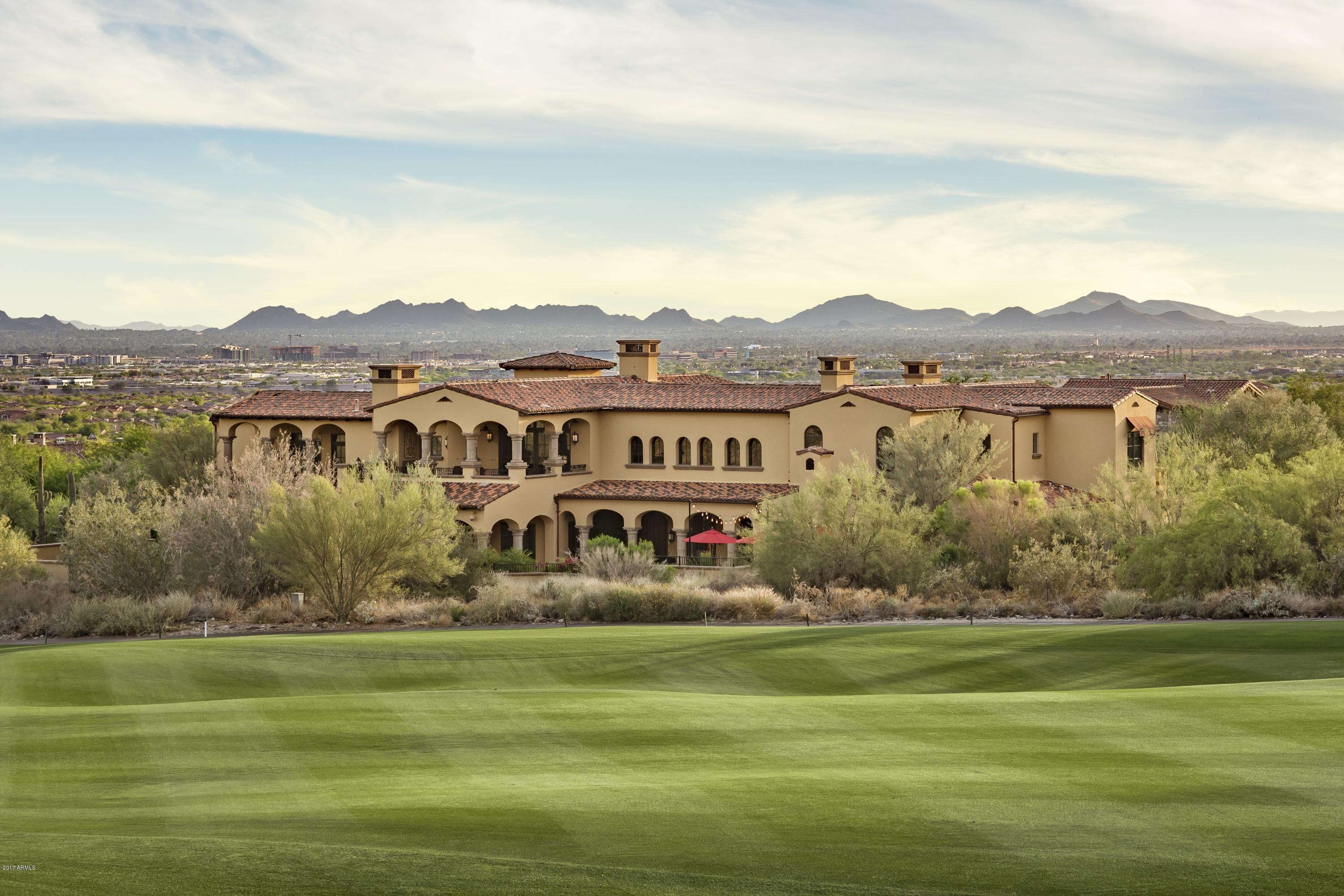 Stunning and impeccable Silverleaf golf property! This 9,293 sf Spanish Colonial masterpiece is a must see. Sitting on over 1 acre of rare golf frontage on the 2nd hole, this stately property offers the best in elegance, entertaining and function. Ideal floorplan for active families and empty nesters alike--four distinct bedroom wings (master and guest house on main level; 3 bdrm kids wing and separate junior master on second floor). Exquisite features throughout: 8 fireplaces, 6 wetbars, 13 premium TV's, luxury home theatre, dynamic Savant home automation, security cameras, commercial walk in freezer, indoor dog shower, 600 bottle walk in wine room, exercise room, 2 powder rooms, pool bath, game room, office w/hidden room, and gated entry.  All this--and close to  Silverleaf Club! In addition, uncommon details are found in every room, including hand carved cabinetry, custom ceiling wood beam work and brick groin vaults, wood and stone flooring; stone columns, built in display cabinetry on 2nd floor catwalk, Viking kitchen appliances, custom fireplace details, and much more. Gracious exterior spaces found in front, middle and back of home. Entry is through an elegant courtyard with fireplace and soothing fountain. Back area features an outdoor living room and BBQ Center facing the pool and large patio, capturing vast mountain and golf views. Two separate covered patios off the game room offer stunning vistas of golf course and city views from second floor--capping off what is surely one of the more exquisite homes in Arizona! - Don't forget to view video in "PHOTO" tab