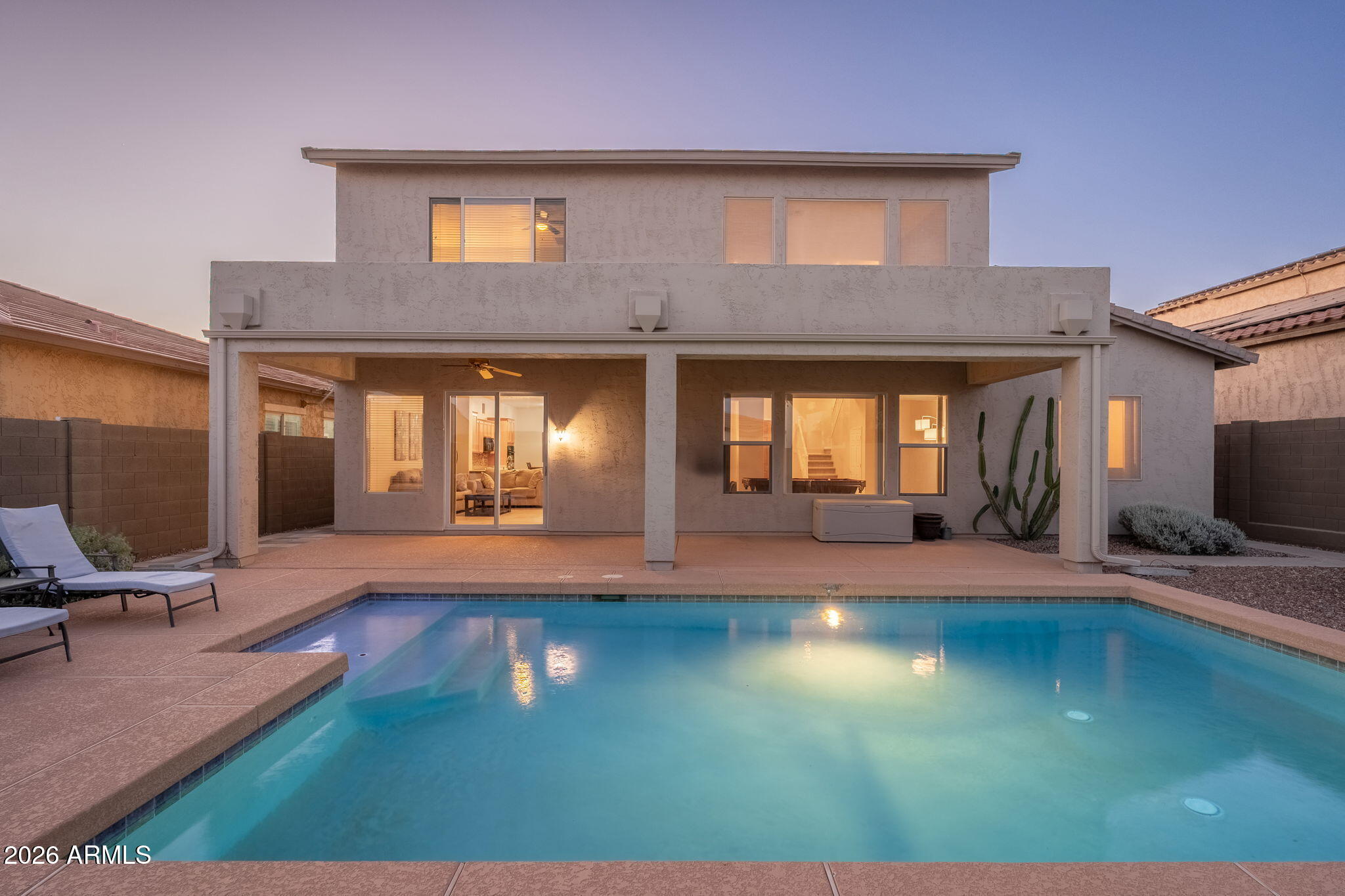 Experience resort-style Anthem living in this beautifully maintained home featuring soaring 21-foot ceilings, breathtaking mountain views, and a sparkling saltwater pool designed for Arizona entertaining. The highly desirable downstairs bedroom and full bath create the ideal setup for guests, multigenerational living, private first-floor living, or a private office.  This home includes two newer Lennox AC Units! The open kitchen boasts new appliances, and a spacious middle island.  The insulated garage has epoxy flooring, storage, and it's own AC unit!  Anthem Parkside has a nearby park, top rated schools & state-of-the-art amenities.  Enjoy a rock-climbing wall, sparkling lap pool, splash water park, tennis, pickleball & movies in the park. Conveniently located to TSMC , I-17 and the 303.