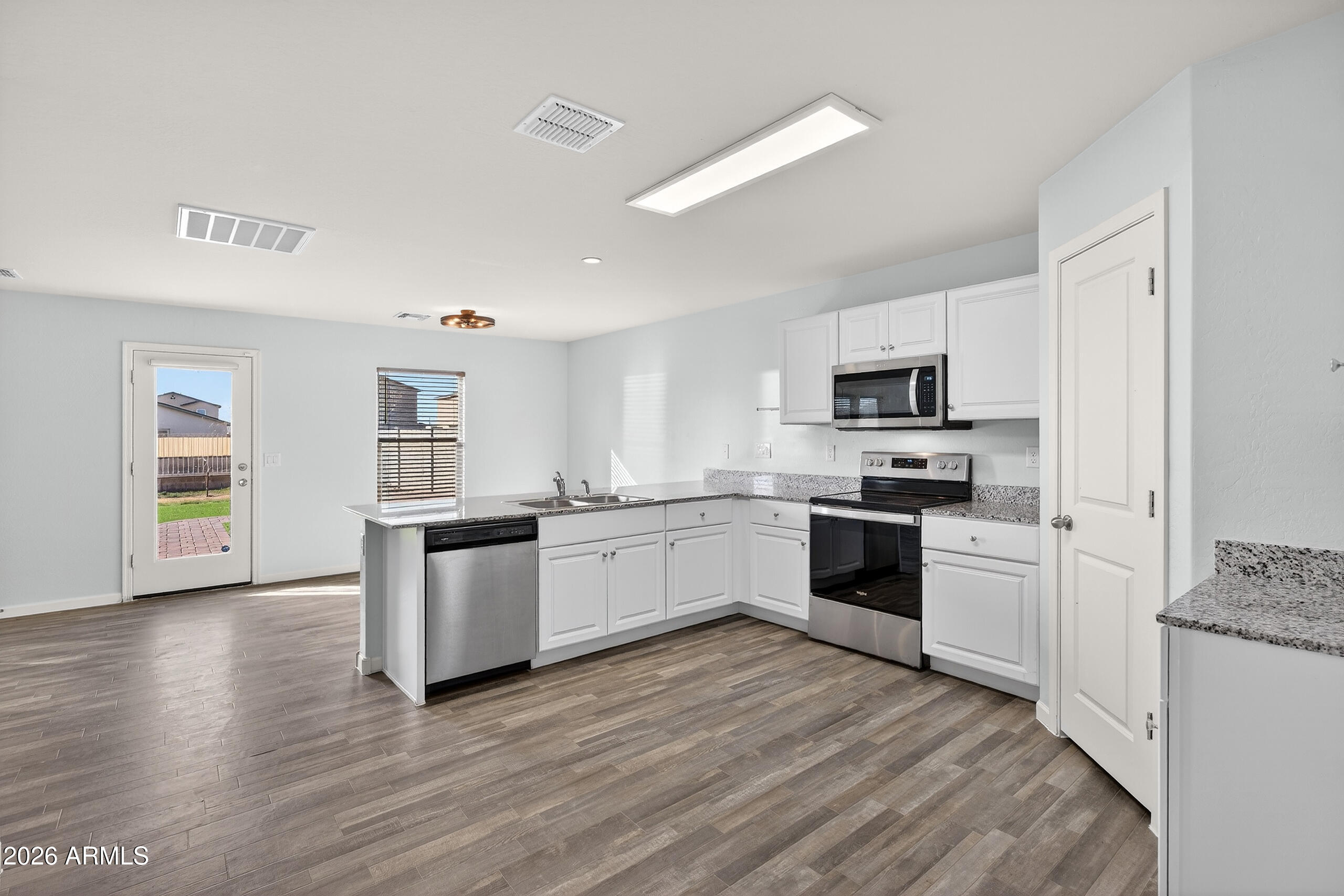 Welcome to easy living in the heart of Coolidge. This bright and thoughtfully designed home offers an open layout that seamlessly connects the living, dining, and kitchen spaces, creating a natural flow for everyday life and weekend gatherings. The kitchen features granite countertops, stainless appliances, and generous cabinetry for effortless functionality. The spacious primary suite provides a quiet retreat, while secondary bedrooms offer flexibility for guests, a home office, or hobbies. Step outside to a low-maintenance backyard with artificial turf and gravel landscaping, perfect for relaxing under Arizona skies. Conveniently located near schools, parks, and commuter routes.