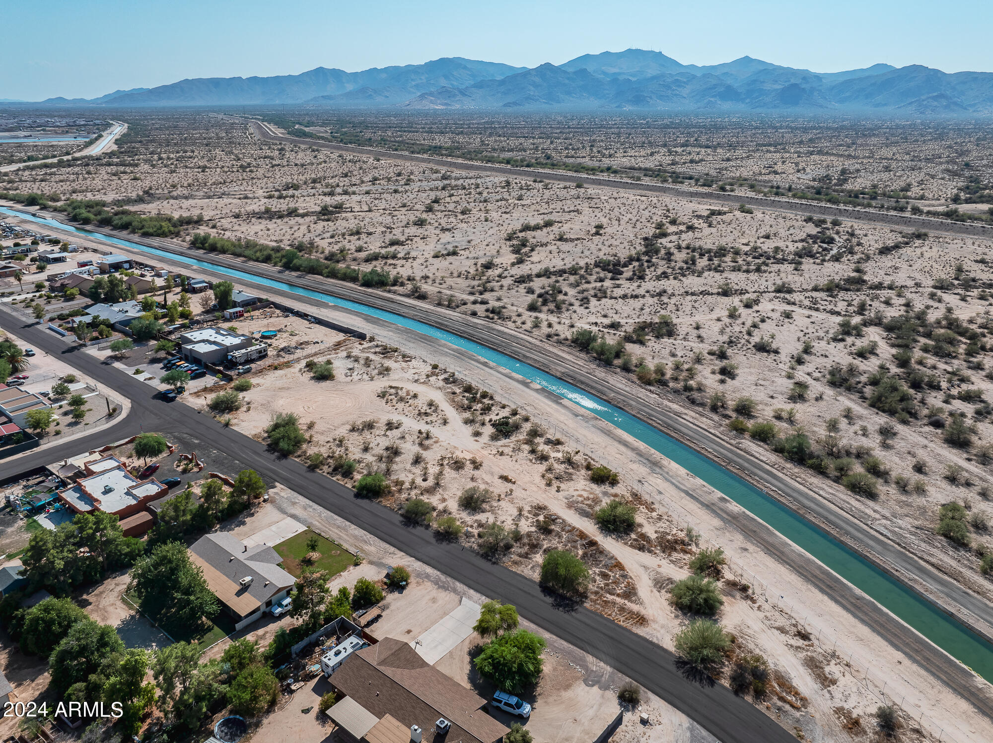 Exceptional land opportunity for anyone looking for a custom build site with pure Arizona splendor!  This expansive property is the largest in the community and is surrounded by homes that are situated on one-acre plots of land. You will have unobstructed views of the majestic White Tank Mountain Range, giving you a front row ticket to epic sunsets and pristine desert landscapes. Convenient access to the Loop 303, World Wildlife Zoo, minutes from the new Prasada development, which includes a growing list of fine dining, shopping, grocery stores and much more. This location is also close to multiple golf courses and schools. Whether you love the great outdoors and enjoy hiking, biking and exploring or the hustle and bustle of city life, this piece of land serves as your key to it all!