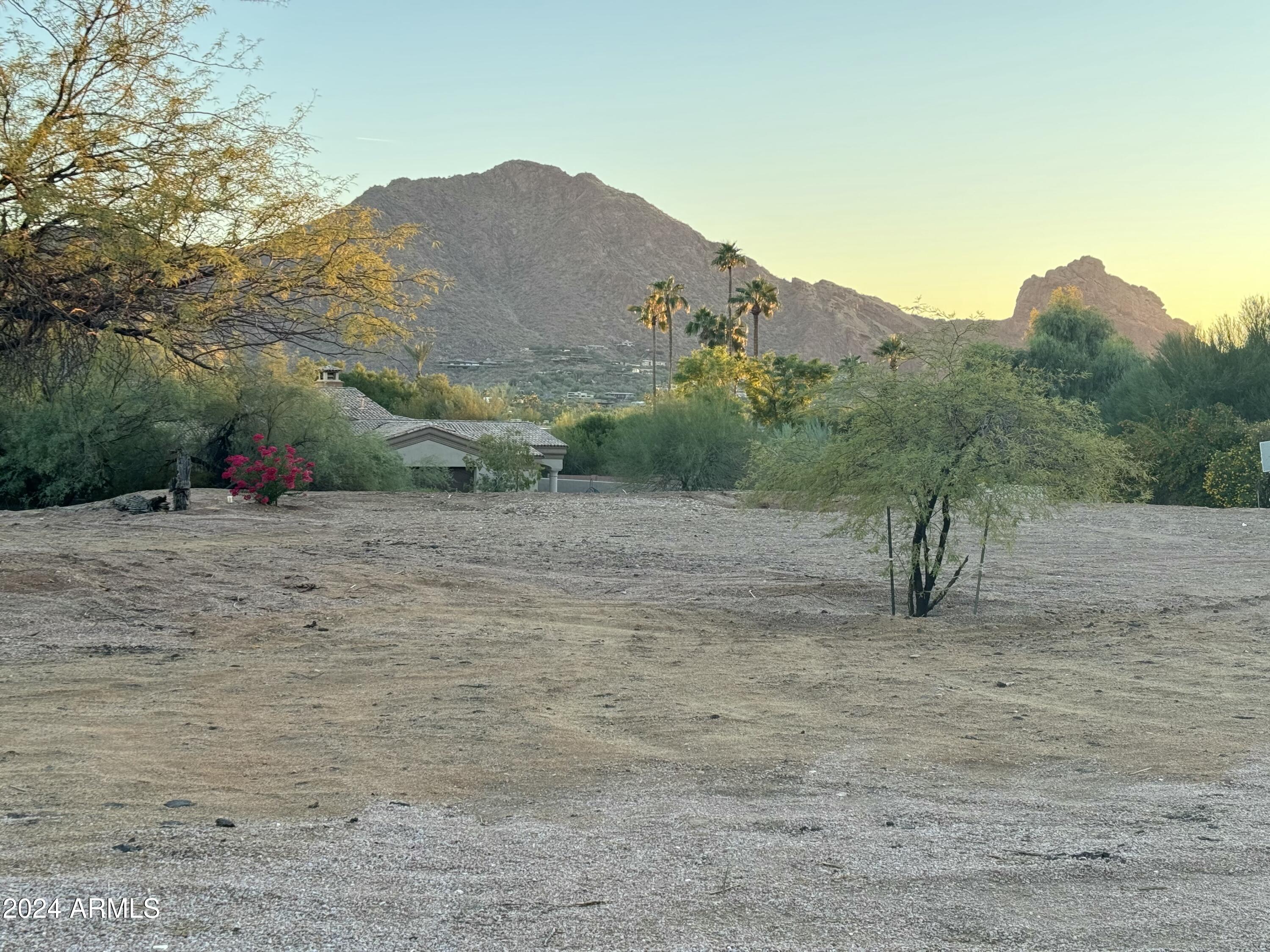 Experience stately views from this 1+ Acre flat lot in the Heart of Paradise Valley between Camelback Mountain and Mummy Mountain! This lot has incredible potential to build your stately dream home offering amazing Camelback Mountain views from head to toe and epic Mummy Mountain views. This lot is conveniently located within minutes from the new Global Ambassador, world class resorts, shopping, dining and golf!  This will sell fast!