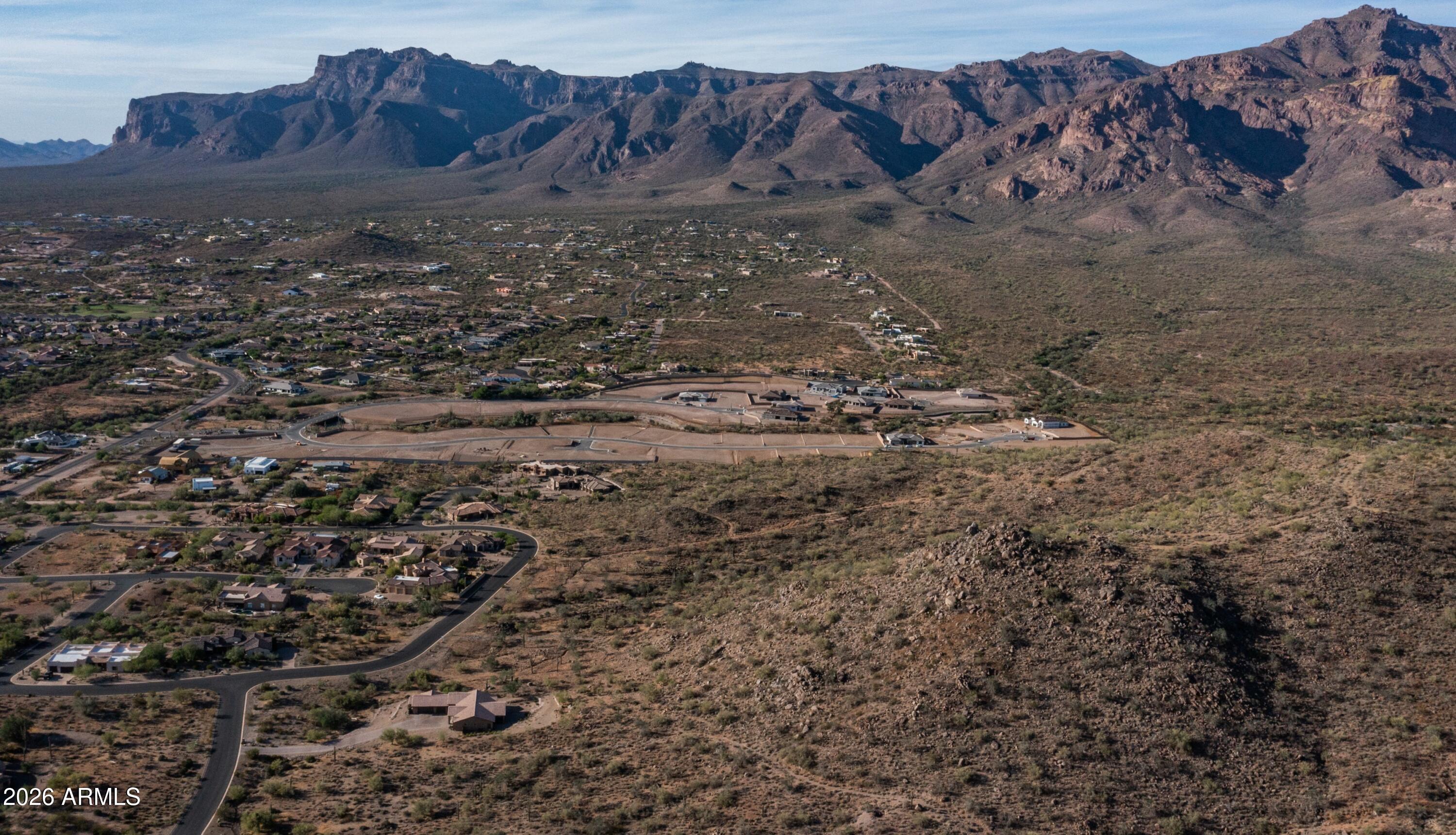 Once-in-a-lifetime opportunity to own some of the most breathtaking, naturally elevated land available in Gold Canyon, AZ! Extraordinary 31.16 acres (4 separate and unique contiguous parcels) sprawling across stunning, awe-inspiring hillside and mountaintop topography offering sweeping, panoramic views and endless potential. Surrounded by the Sonoran Desert, thousands of acres of pristine State Trust Land, wide open skies, luxury homes, and gated communities, this amazing acreage captures unparalleled sightlines, sunrises, sunsets, and starry nights. At $80,000 per acre, the property delivers incredible value for those looking to build something special or simply hold as a legacy investment. A rare, premium piece of nature waiting for a visionary who dreams big! Pure, unmatched beauty!!!!
