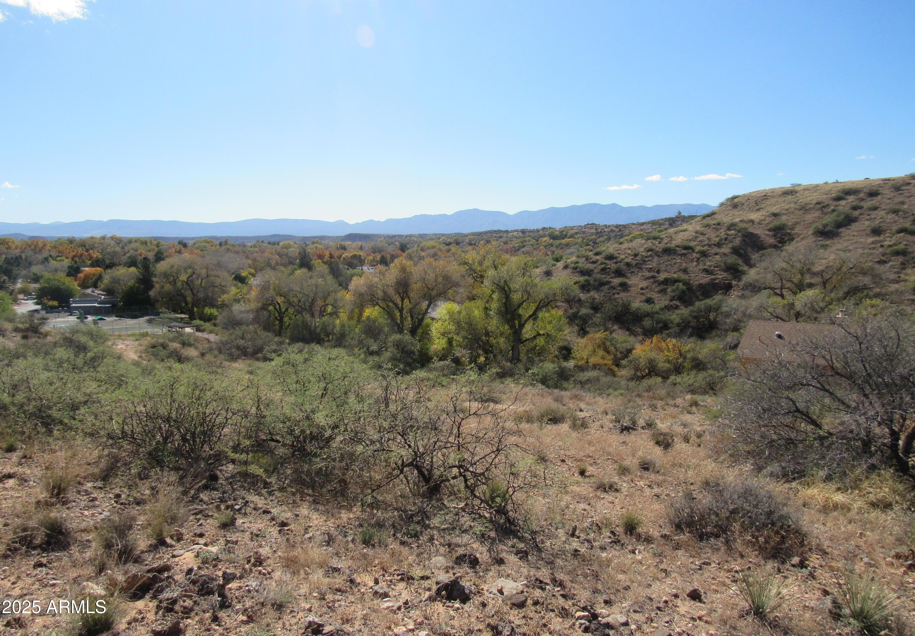 Build your dream home on this elevated vacant land located in the beautiful, gated community of Oak Creek Valley in Cornville, AZ! This private neighborhood sits along both Spring Creek and Oak Creek, offering lush scenery, peace, and abundant wildlife just minutes from Sedona and Cottonwood. The spacious, gently sloped lot provides an ideal custom home site with design flexibility and stunning views. Enjoy community amenities including a clubhouse, pool, tennis and basketball courts, and private river access perfect for fishing, kayaking, or relaxing by the water. Experience the best of Arizona creekside living in one of Cornville's most desirable gated communities!